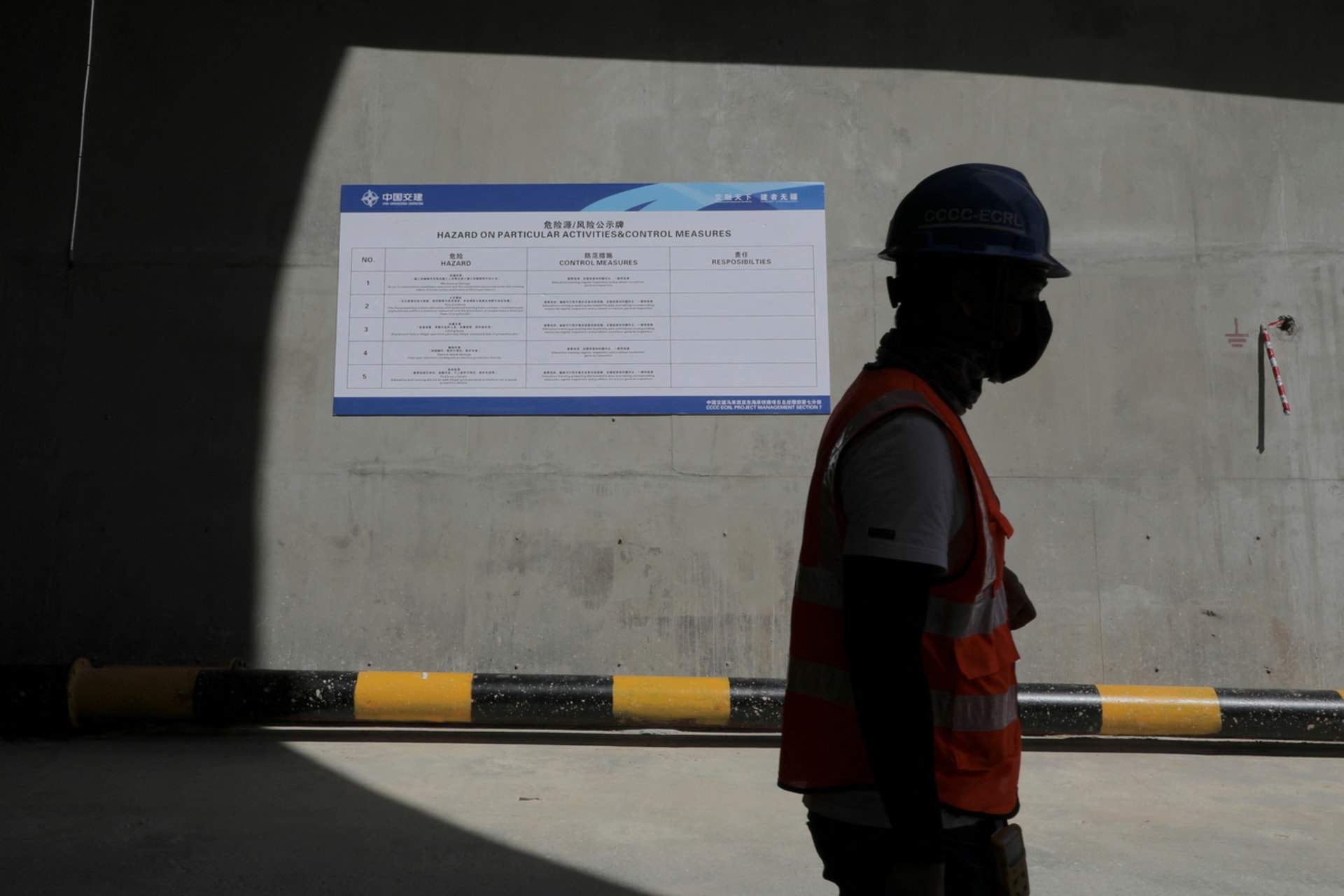 <p>A worker walks out of a tunnel at the construction site of East Coast Rail Link (ECRL), a Chinese-invested railway project part of the Beijing ‘Belt and Road Initiative.’</p>
