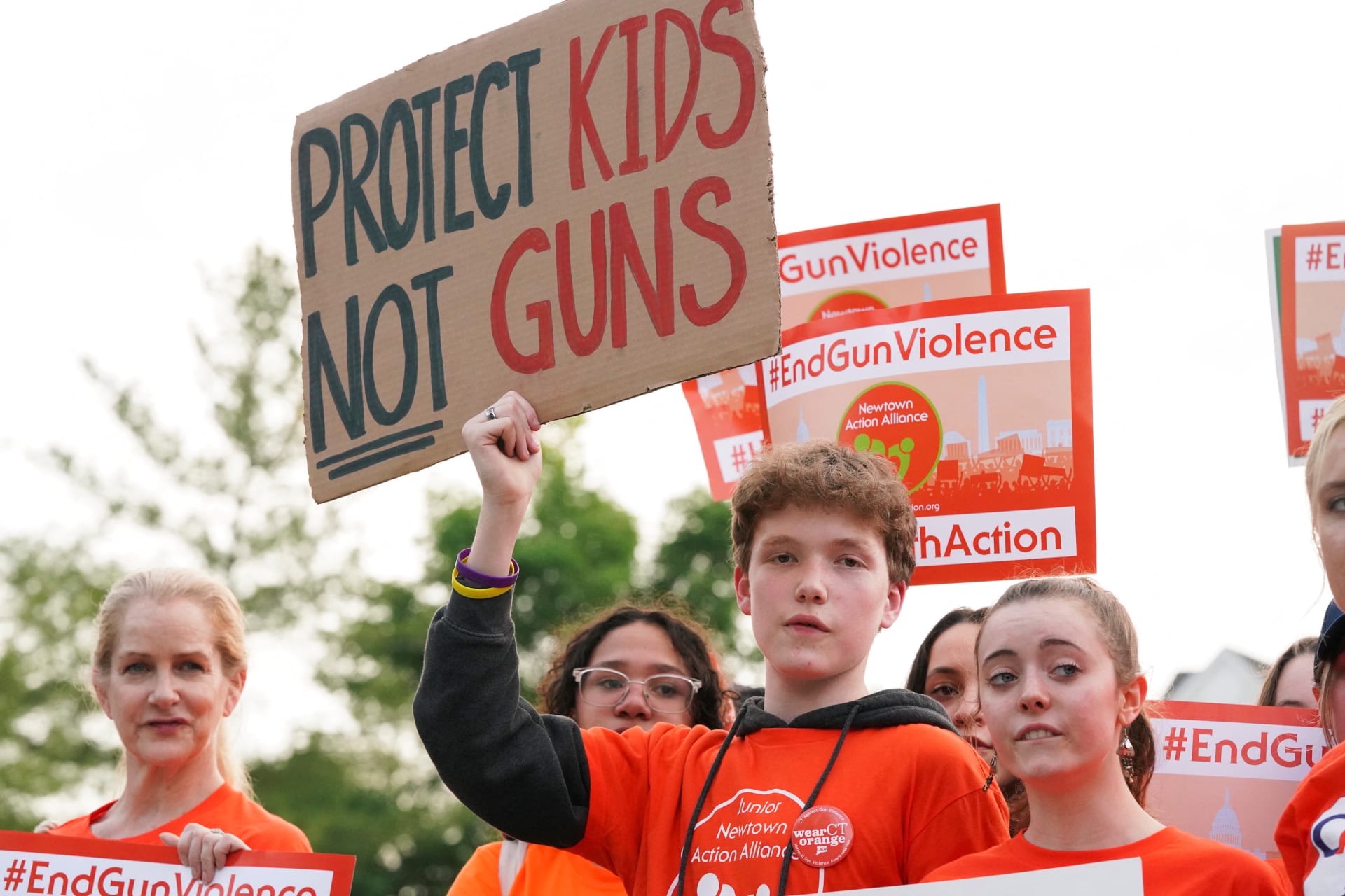 <p>People attend a march and rally against gun violence on June 3, 2022, in Newtown, Connecticut, where almost a decade ago a gunman shot and killed twenty-six people including twenty children at Sandy Hook Elementary School.</p>
