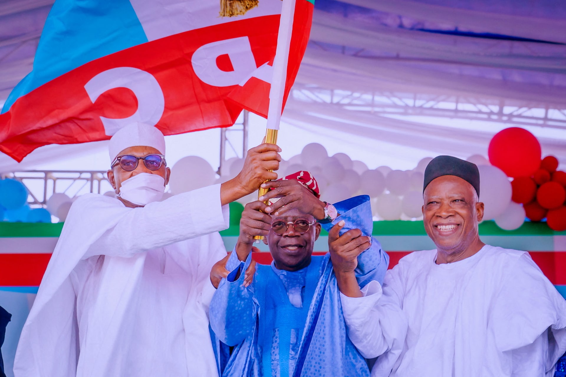 <p>All Progressives Congress (APC) party’s new presidential candidate Bola Tinubu holds his party’s flag with President Muhammadu Buhari and Abdullahi Adamu, the APC party chairman, during the party convention in Abuja, Nigeria on June 7th, 2022. </p>
