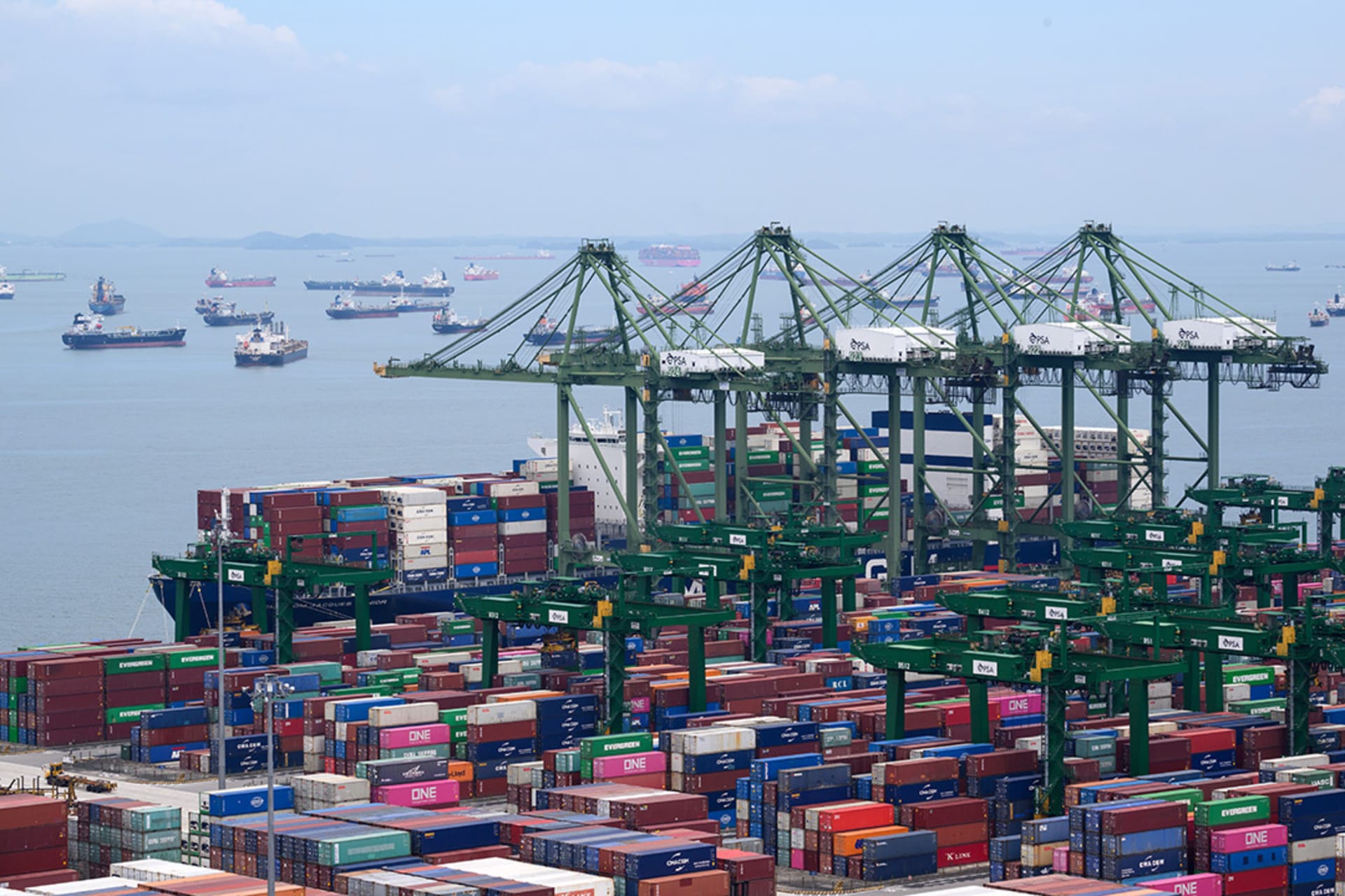 <p>Containers are loaded at the Port of Singapore, the second largest port in the world.</p>
