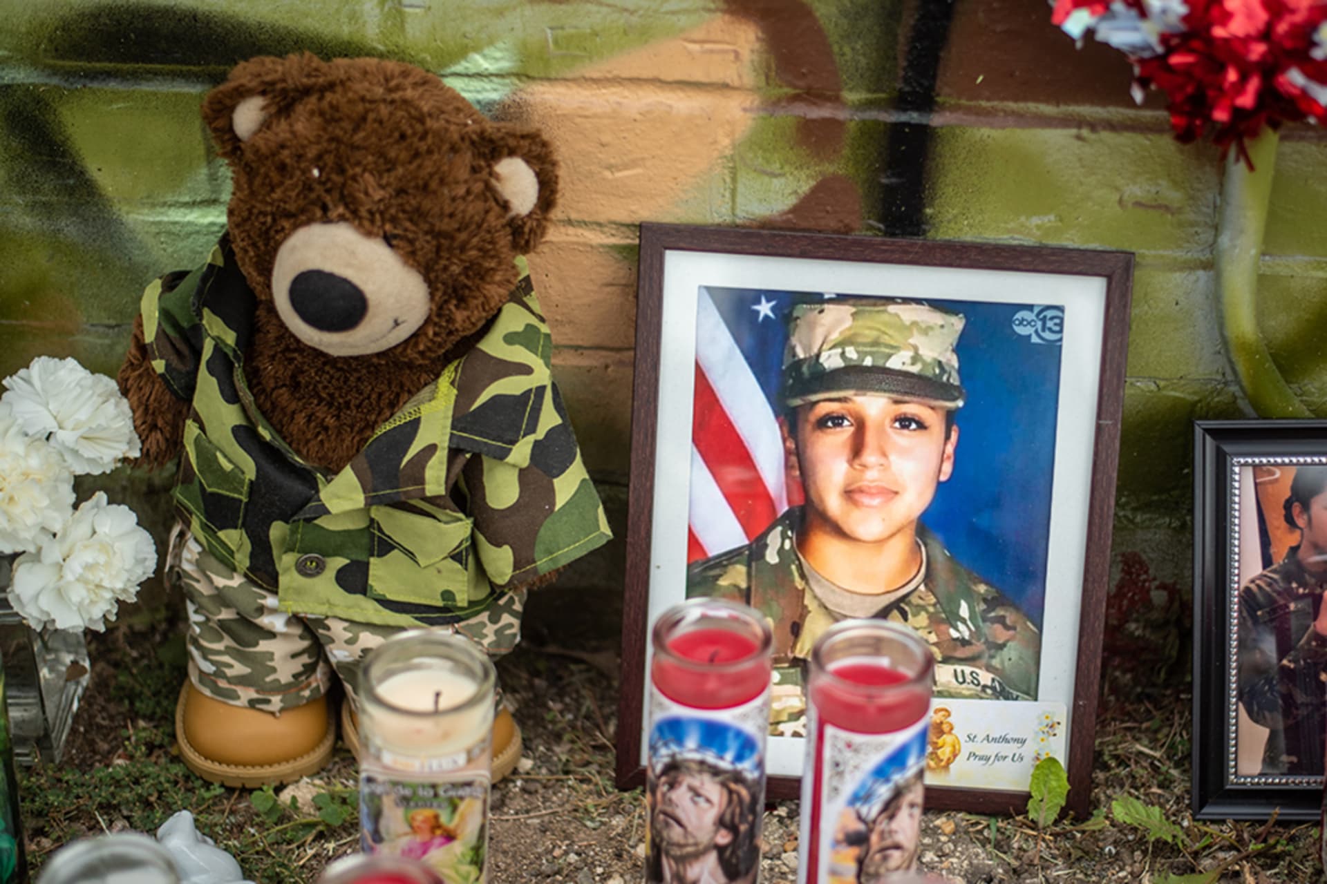 <p>People pay respects at a vigil for Vanessa Guillén, a U.S. Army soldier murdered at Fort Hood in 2020.</p>
