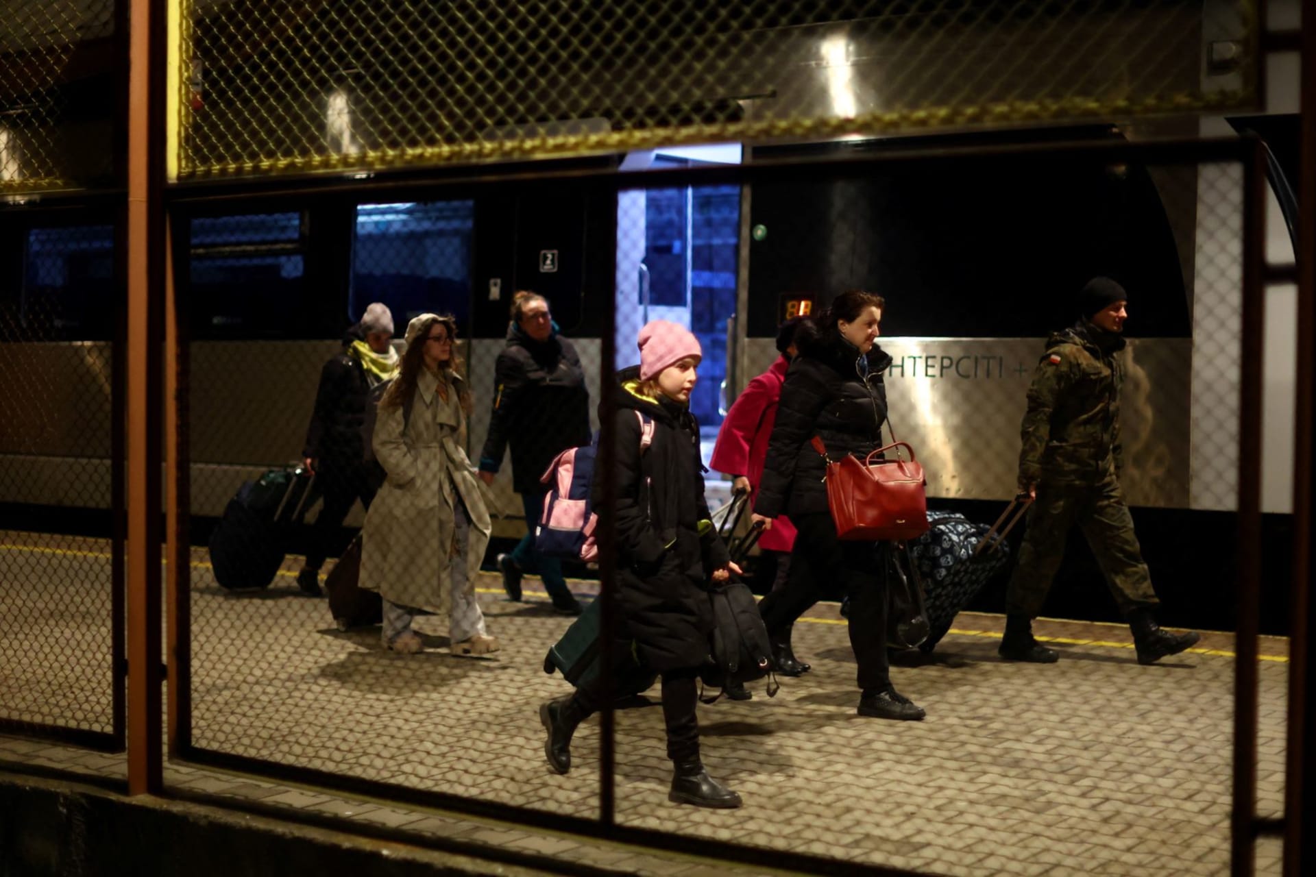 <p>Ukrainian refugees disembark a train from Ukraine at Przemysl Glowny train station, after fleeing the Russian invasion of Ukraine, in Przemysl, Poland on April 3, 2022.</p>