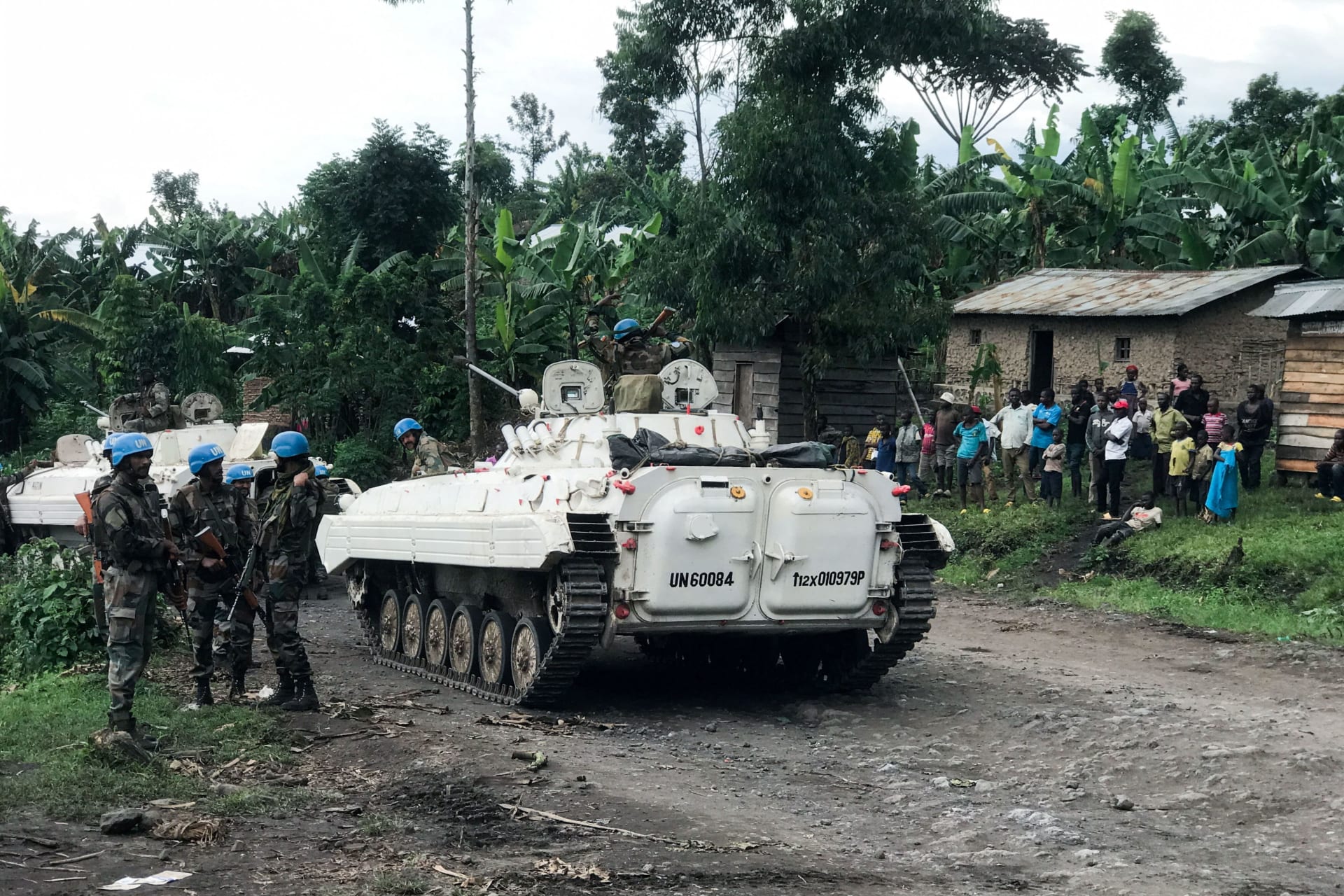 <p>United Nations Organization Stabilization Mission in the Democratic Republic of the Congo (MONUSCO) peacekeepers are seen with civilians as they patrol areas affected by the recent attacks by M23 rebels fighters in North Kivu, east Congo in March 2022. </p>
