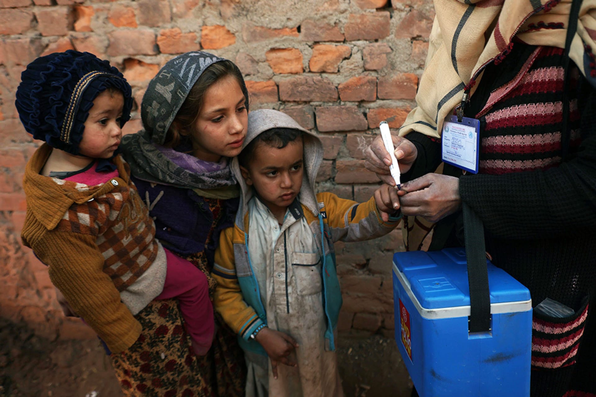 <p>A health worker marks a child’s finger during a vaccination campaign near Islamabad.</p>

