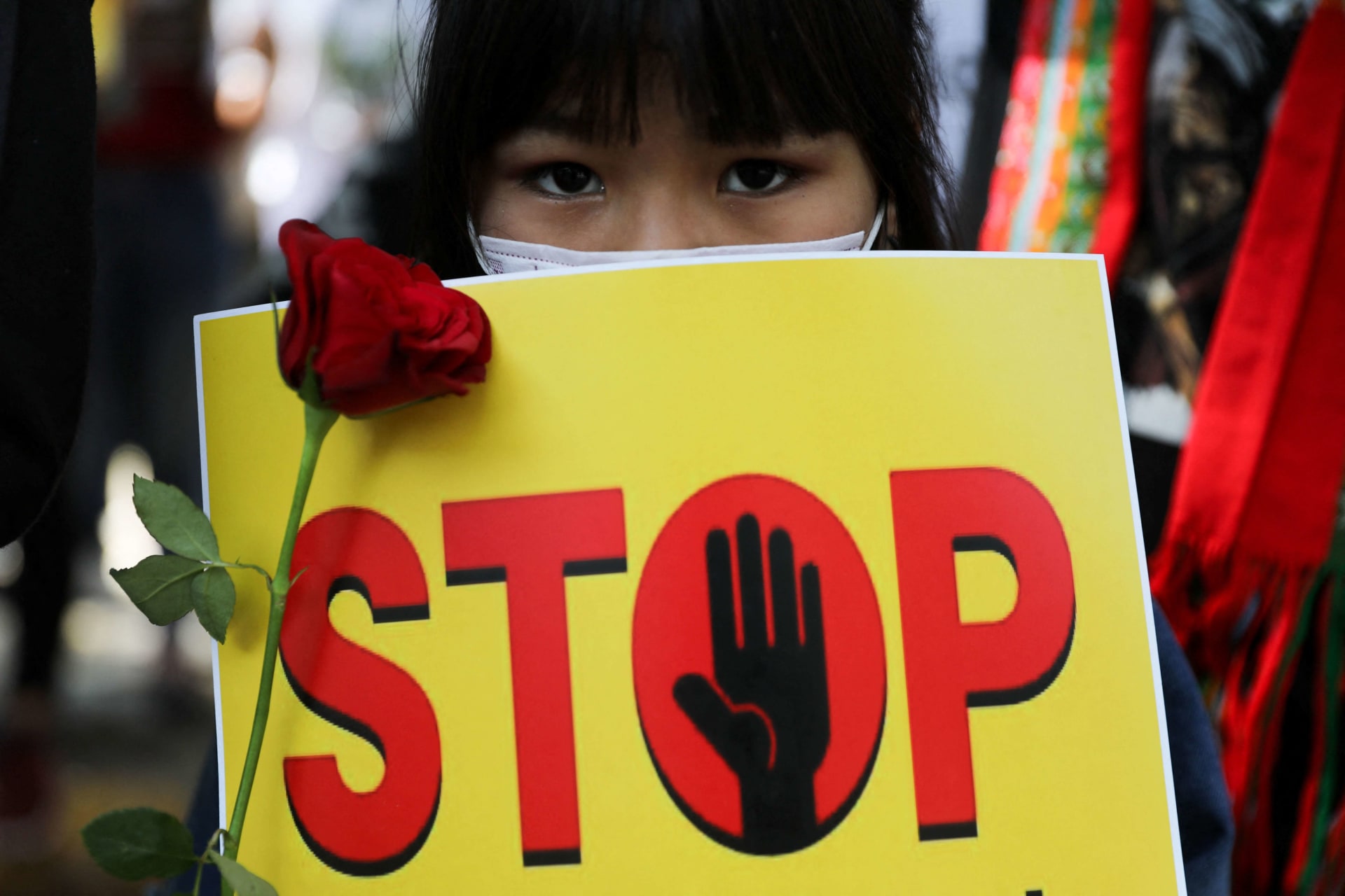 <p>A girl holds a placard as she attends a protest, organized by pro-democracy supporters, against the military coup in Myanmar and demanding recognition of the National Unity Government of Myanmar, in New Delhi, India, on February 22, 2022.</p>
