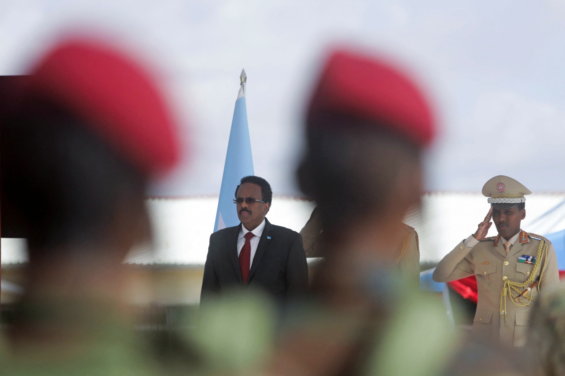 <p>Somalia’s President Mohamed Abdullahi Mohamed looks on as military officers parade during celebrations to mark the 62nd anniversary of the Somali National Armed Forces in Mogadishu, Somalia on April 12, 2022.</p>
