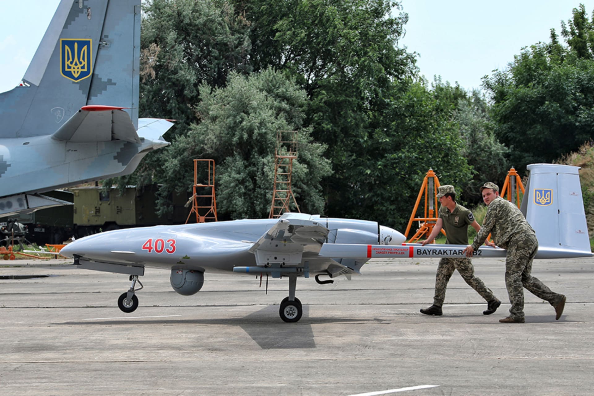<p>Soldiers push a Bayraktar TB2 drone on a tarmac in southern Ukraine during an exercise in 2021.</p>
