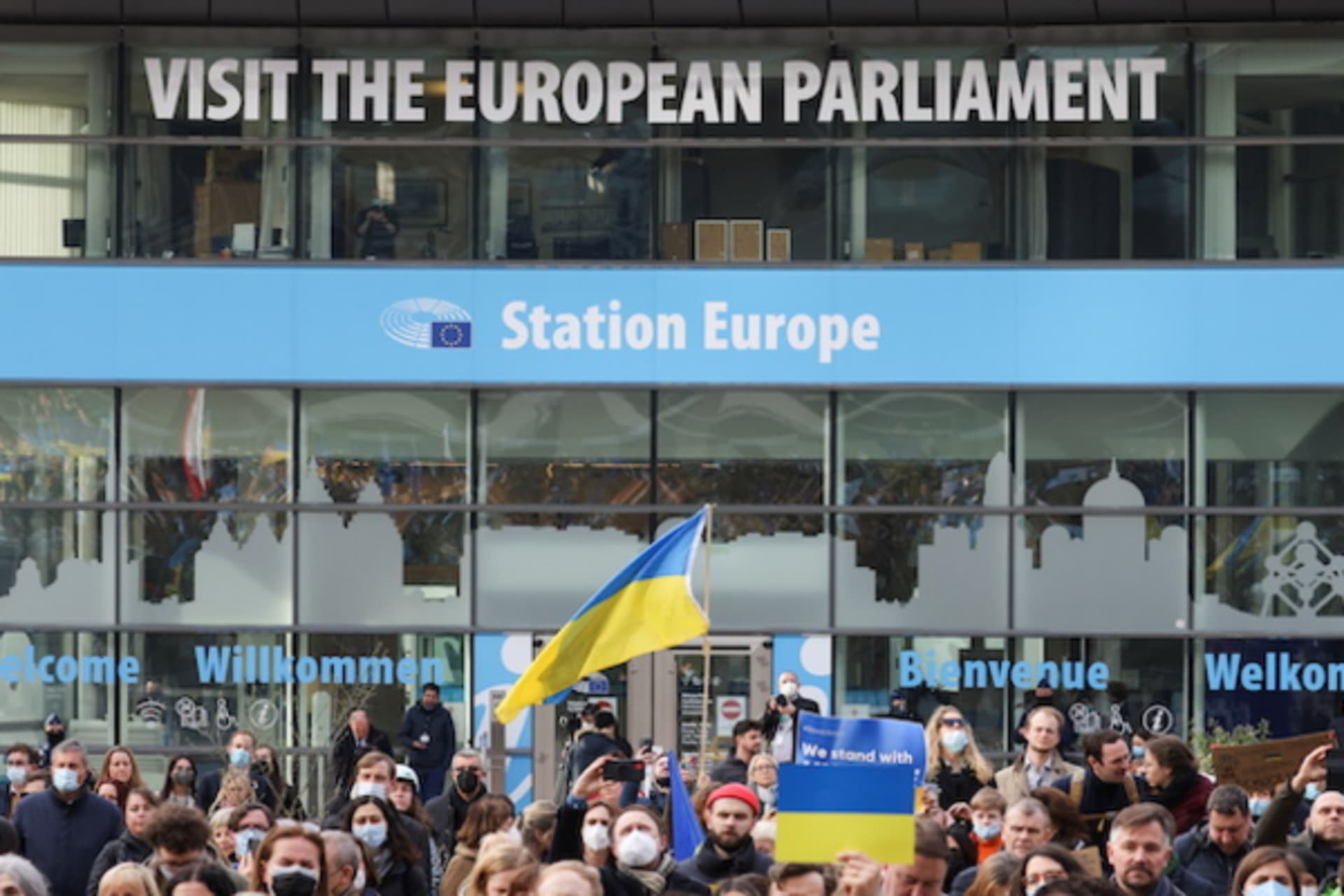 <p>People carry flags and banners at a protest of members of the European Parliament and citizens, including Ukrainian living in Belgium, in support of Ukraine and against the war, amid Russia’s invasion of Ukraine, in Brussels, Belgium on March 1, 2022.</p>
