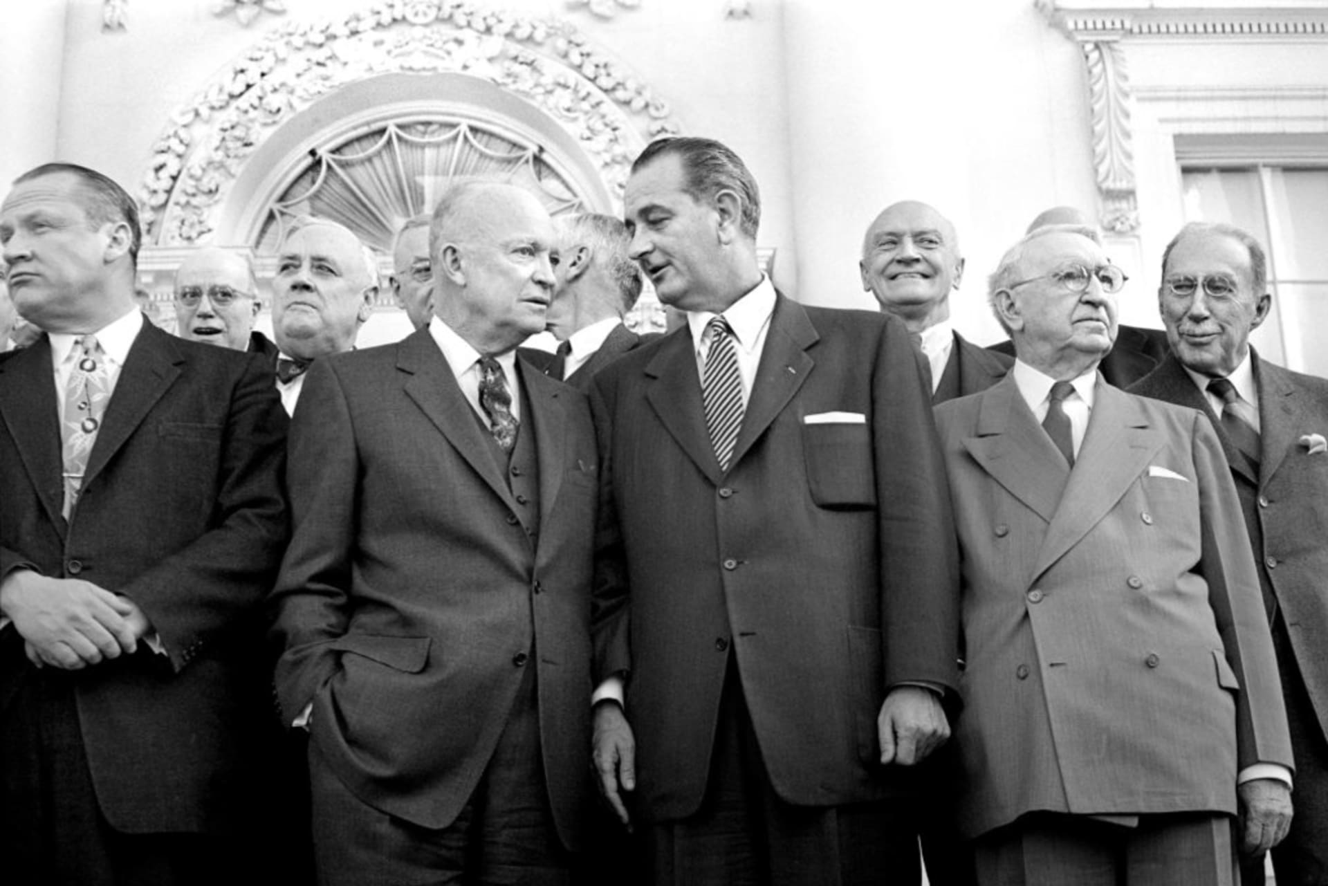 <p>President Dwight D. Eisenhower, then-Senator Lyndon B. Johnson, and Secretary of State John Foster Dulles stand together during a luncheon at the White House on March 31, 1955. </p>
