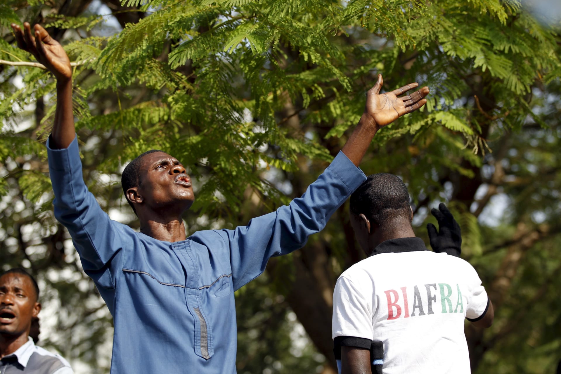 <p>A Biafra supporter prays during a rally in support of Indigenous People of Biafra (IPOB) leader Nnamdi Kanu in Abuja, Nigeria on December 1, 2015.</p>

