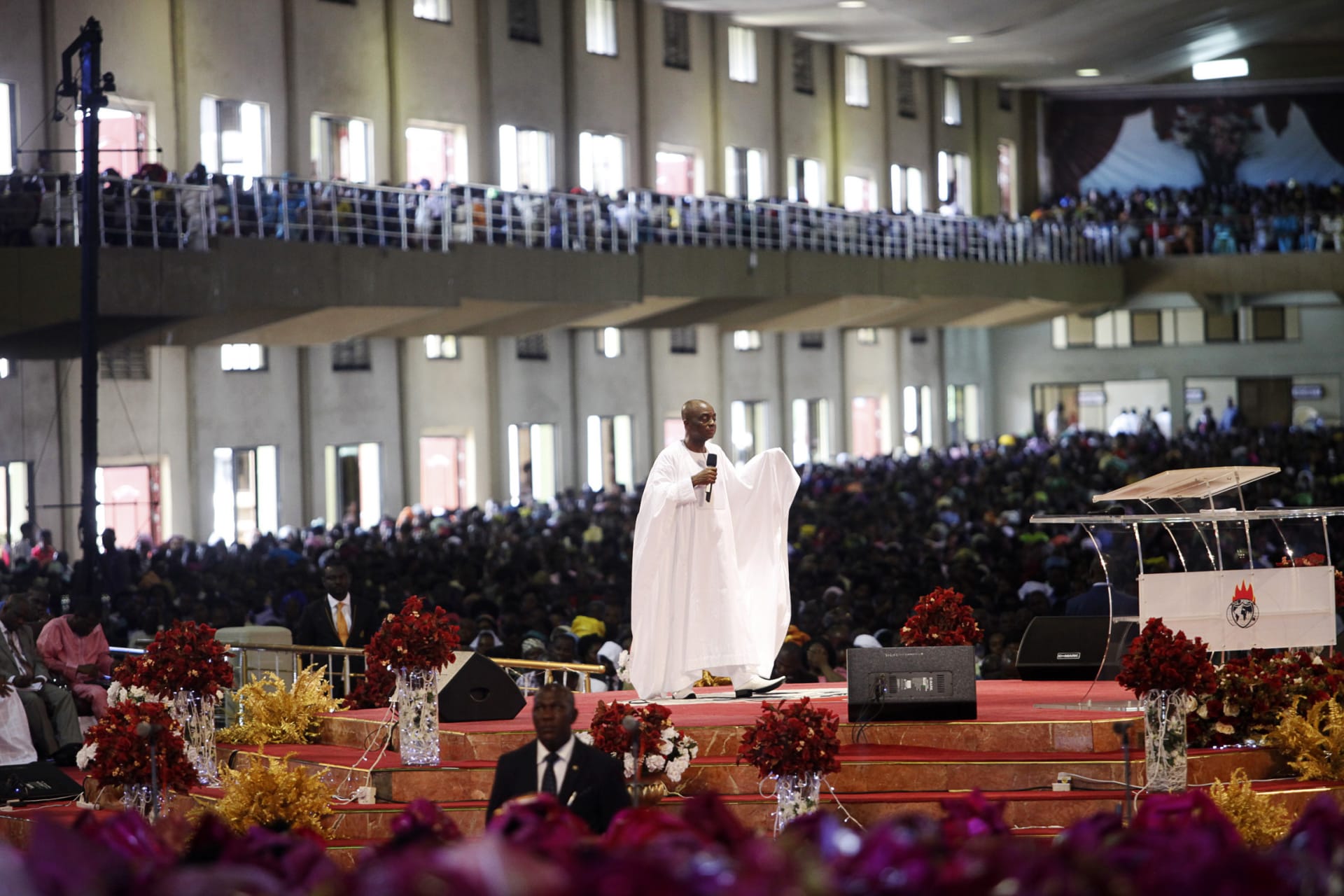 <p>Bishop David Oyedepo, founder of the Living Faith Church, conducts a service for worshippers in the auditorium of the church in, Ogun state, Nigeria on September 28, 2014.</p>
