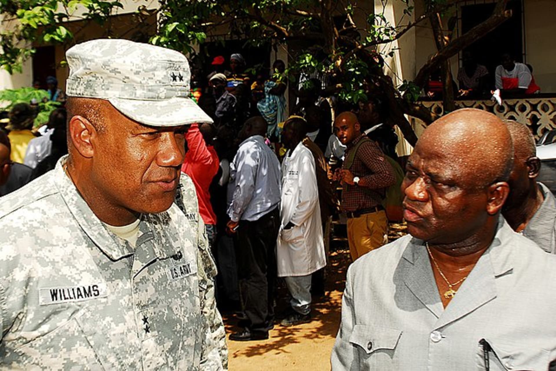 <p>Maj. Gen Darryl A. Williams, former commander of Joint Forces Command-Operation United Assistance Assistance speaks with Liberian Minister of National Defense Hon. Brownie Samukai, during a tour of a rural village in Liberia on October 20, 2014.</p>
