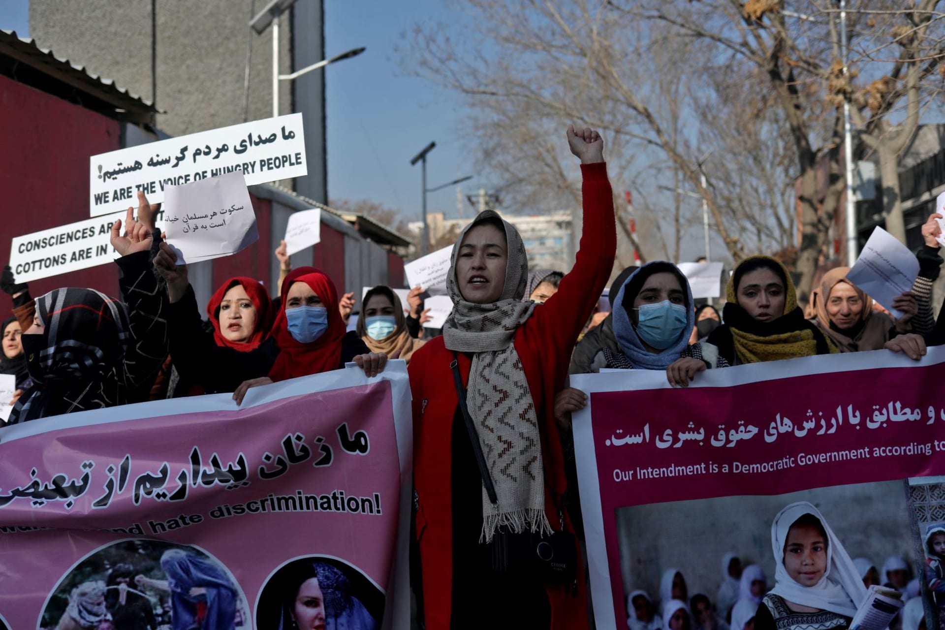 <p>Afghan women shout slogans during a rally to protest against what the protesters say is Taliban restrictions on women, in Kabul, Afghanistan on December 28, 2021.</p>
