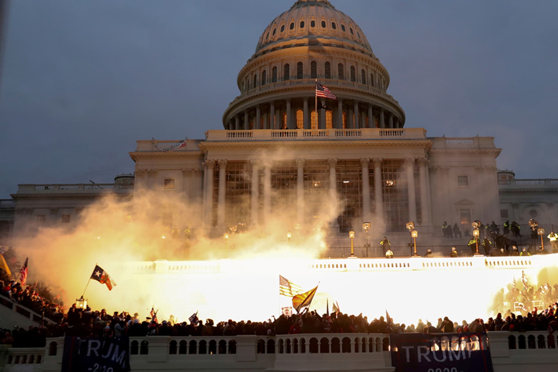 <p>An explosion caused by a police munition is seen during the storming of the U.S. Capitol Building in Washington, January 6, 2021.</p>
