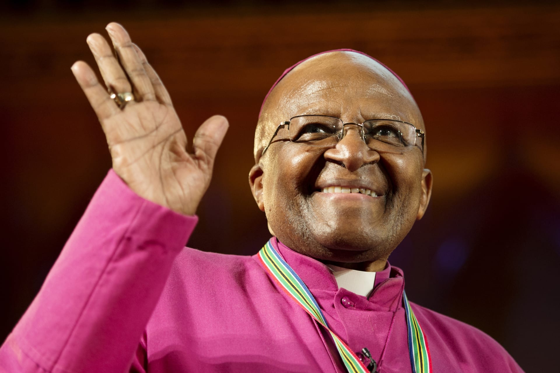 <p>Archbishop Emeritus Desmond Tutu waves after receiving the Templeton Prize in London on May 21, 2013.</p>
