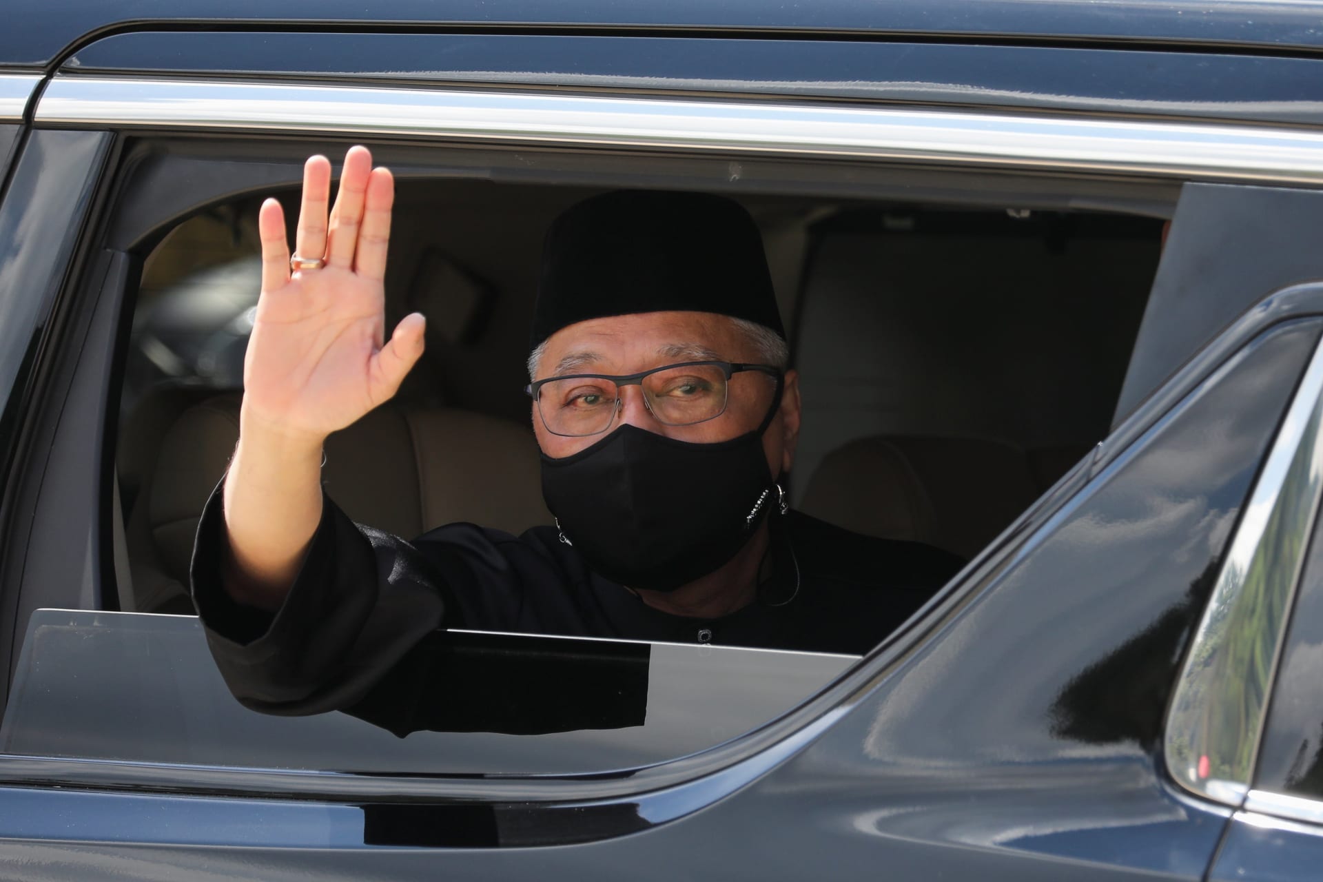 <p>New Malaysian Prime Minister Ismail Sabri Yaakob waves from a car, as he leaves after the inauguration ceremony, in Kuala Lumpur, Malaysia on August 21, 2021.</p>
