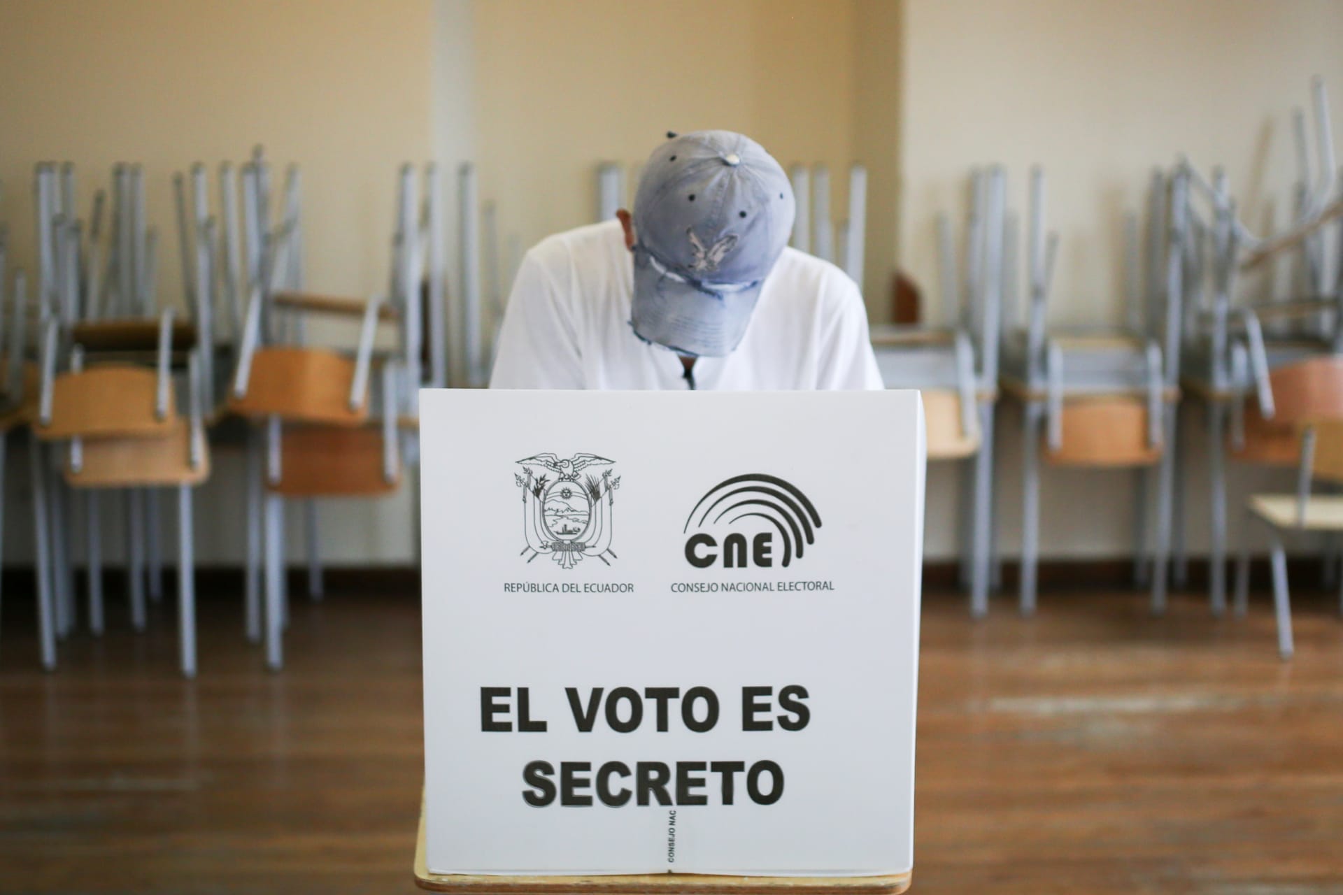 <p>A voter fills out a ballot at a polling station during Ecuador’s second round of presidential elections on April 11, 2021. </p>
