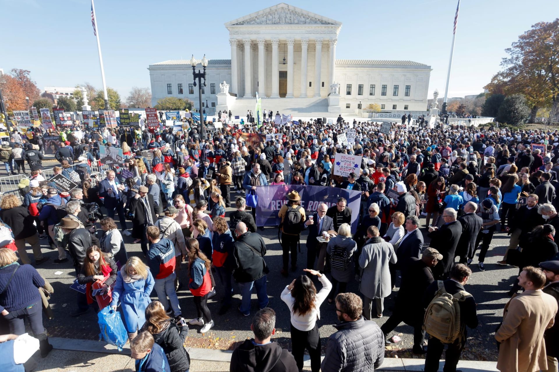 <p>People gather outside the Supreme Court building on the day of arguments in the Mississippi abortion rights case Dobbs v. Jackson Women’s Health, in Washington, U.S., December 1, 2021.</p>