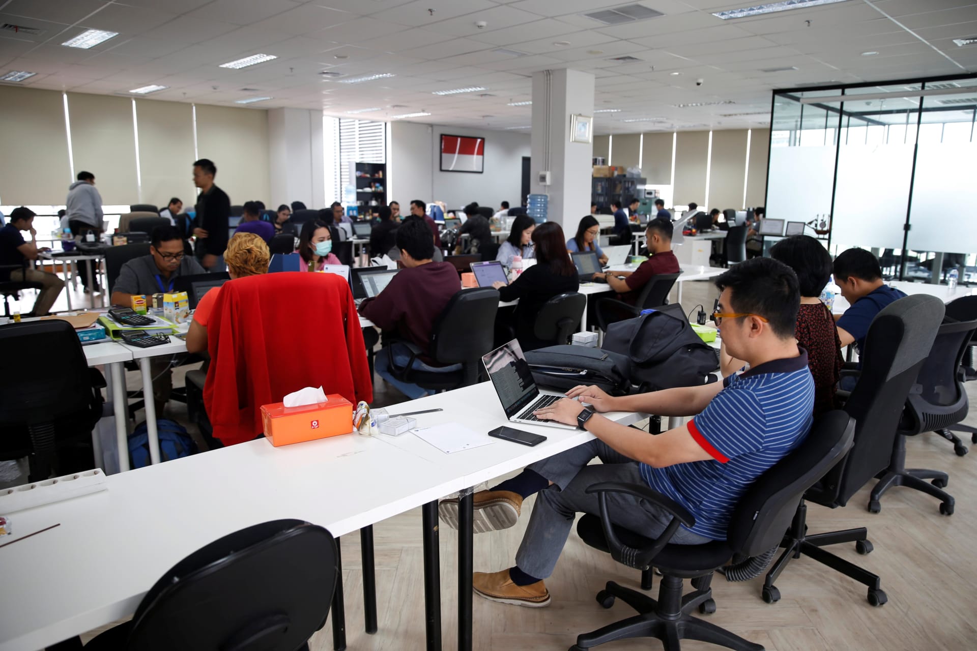 <p>Employees work at the office of Modalku, an Indonesian financial technology (fintech) startup, in Jakarta, Indonesia on January 29, 2018.</p>
