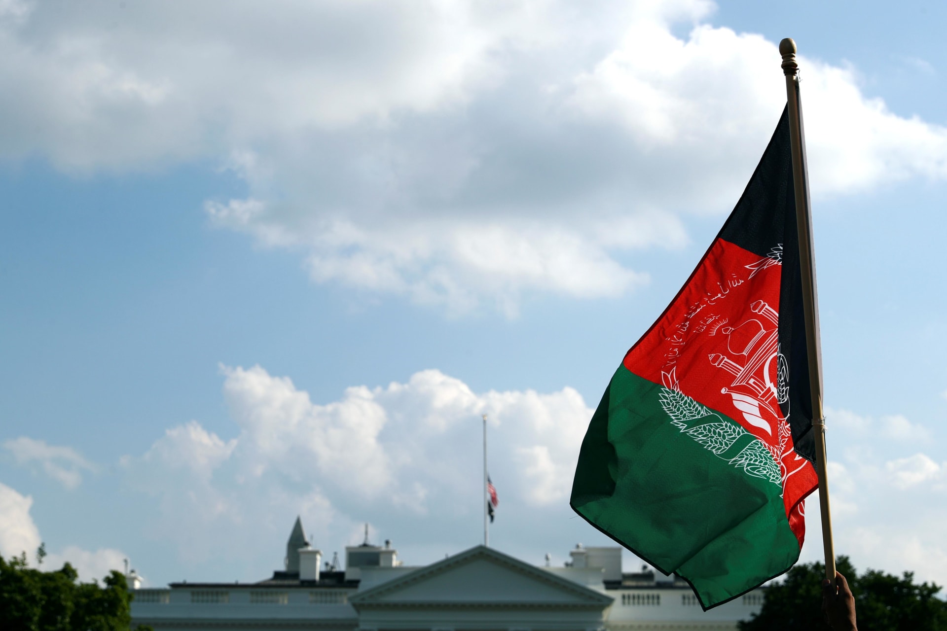 <p>An Afghan flag flying in front of the White House on August 28, 2021.</p>

