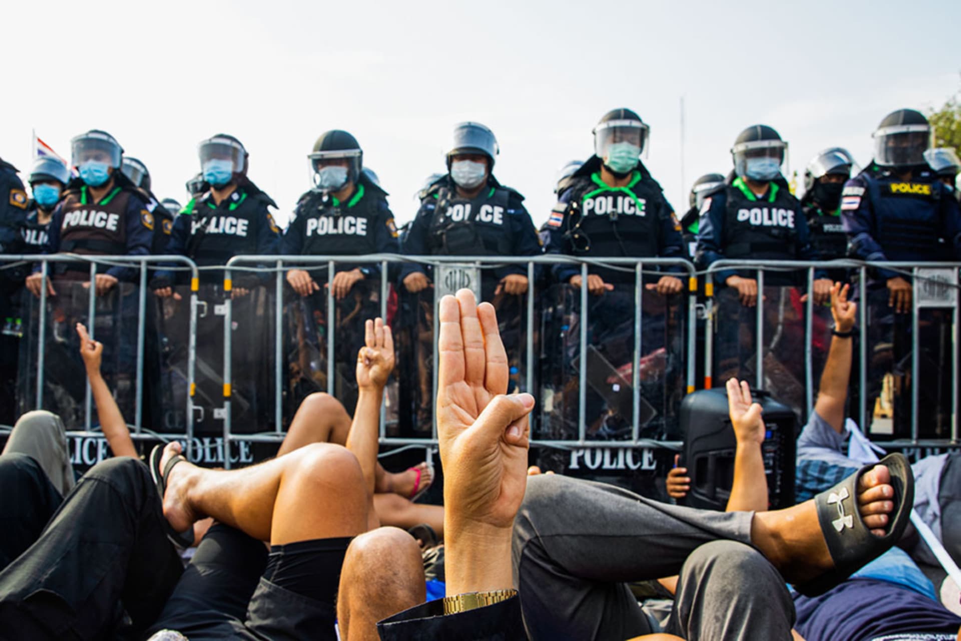 <p>Pro-democracy protesters in Thailand raise their hands in a three-finger salute.</p>
