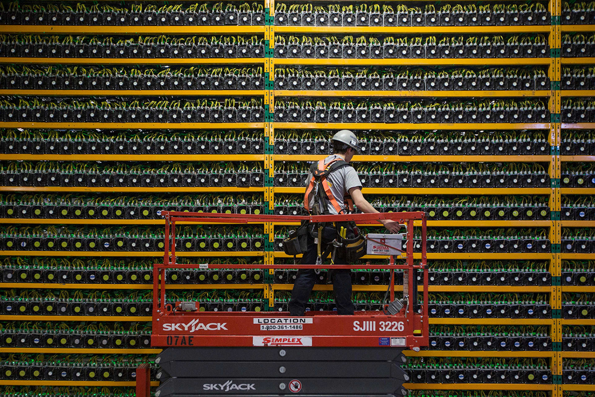 <p>A technician inspects a Bitcoin mining operation in Quebec, Canada.</p>
