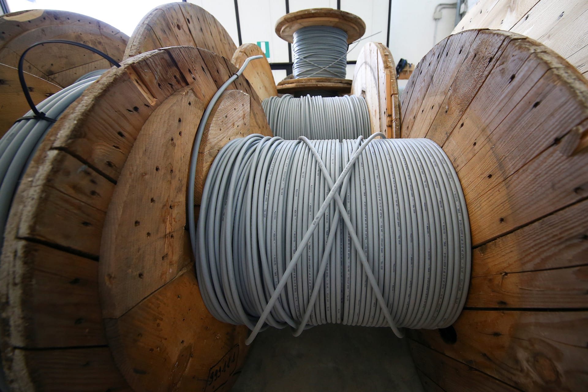 <p>Reels of optical fiber cables are seen in a storage area in Perugia, Italy, June 23, 2017.</p>
