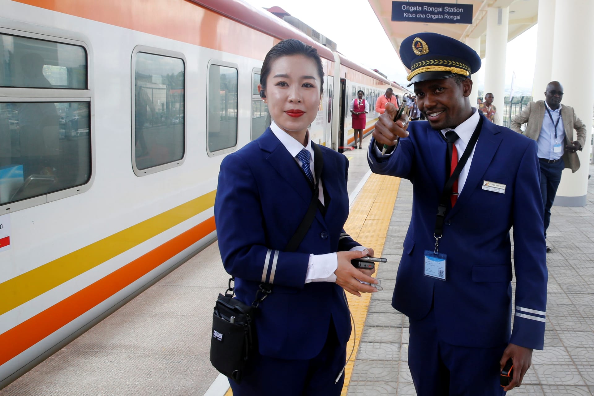 <p>Kenya Railways attendants talk next to a train along the Standard Gauge Railway (SGR) line constructed by the China Road and Bridge Corporation (CRBC) and financed by the Chinese government in Ongata Rongai, Kenya, on October 16, 2019.</p>
