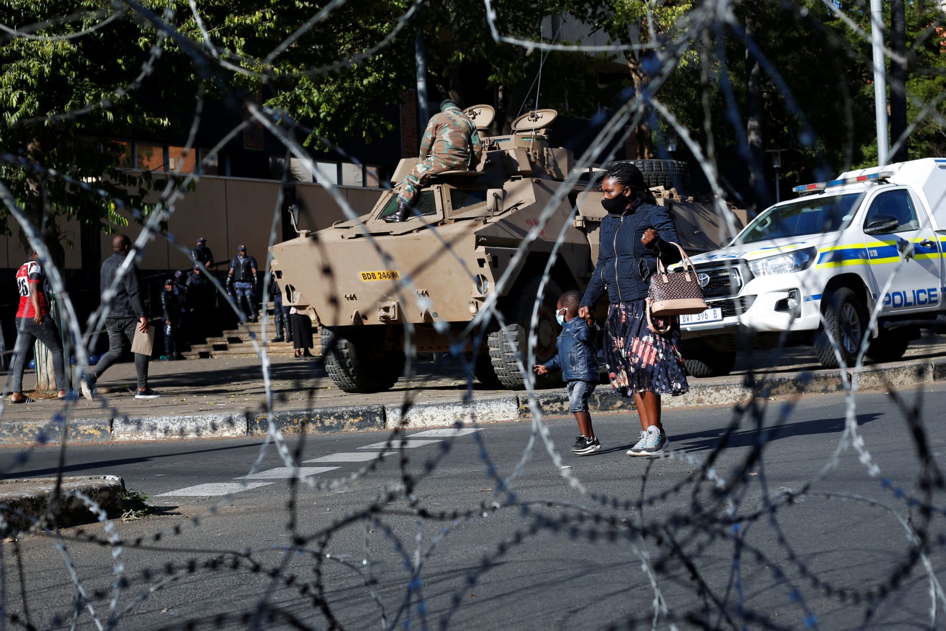 <p>Soldiers and policemen stand guard near the court where former South Africa President Jacob Zuma was to appear in Pietermaritzburg, South Africa on August 10, 2021.</p>
