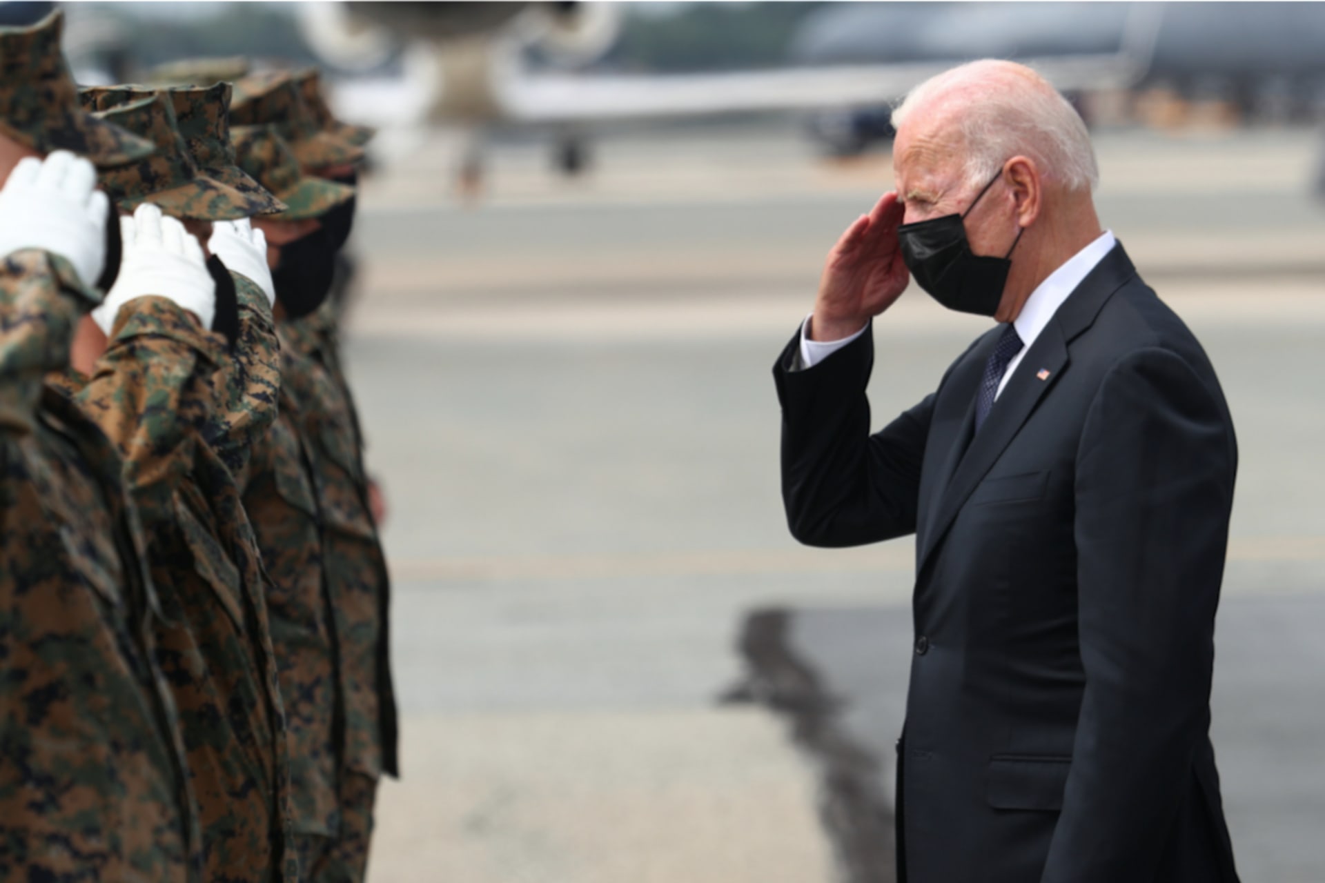 <p>President Joe Biden salutes members of the U.S. Marine Corps Honor Guard. </p>
