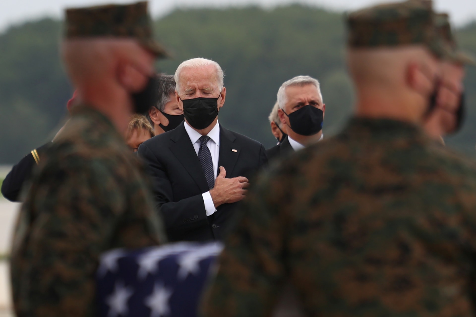 <p>U.S. President Joe Biden salutes during the dignified transfer of the remains of U.S. Military service members who were killed by a suicide bombing at the Hamid Karzai International Airport on August 29, 2021.</p>
