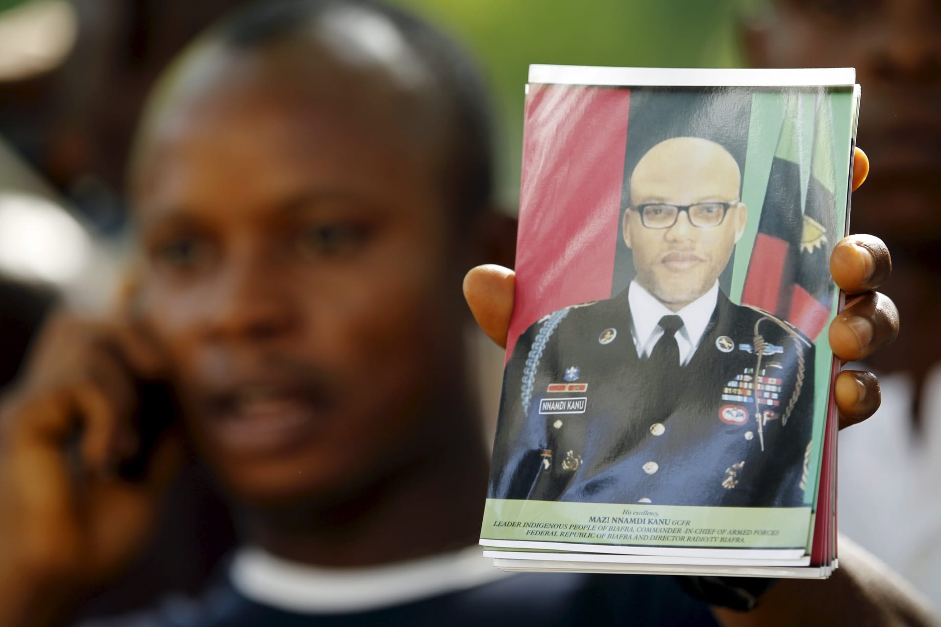 <p>A supporter of Indigenous People of Biafra (IPOB) leader Nnamdi Kanu holds a photograph of Kanu during a rally in Abuja, Nigeria on December 1, 2015.</p>
