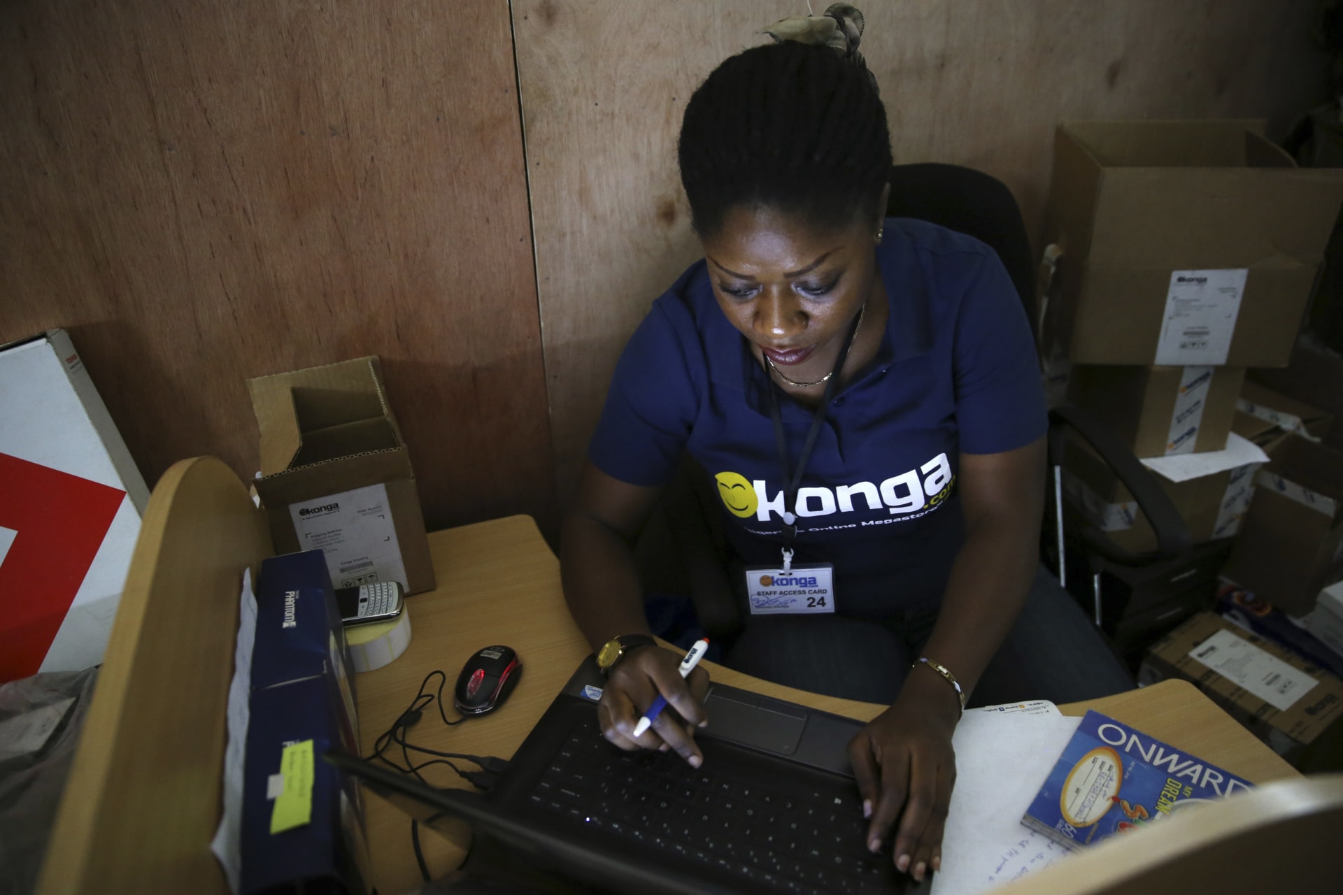 <p>A staff inputs data into a computer at the warehouse of Konga online shopping company in Ilupeju district in Nigeria’s commercial capital Lagos</p>