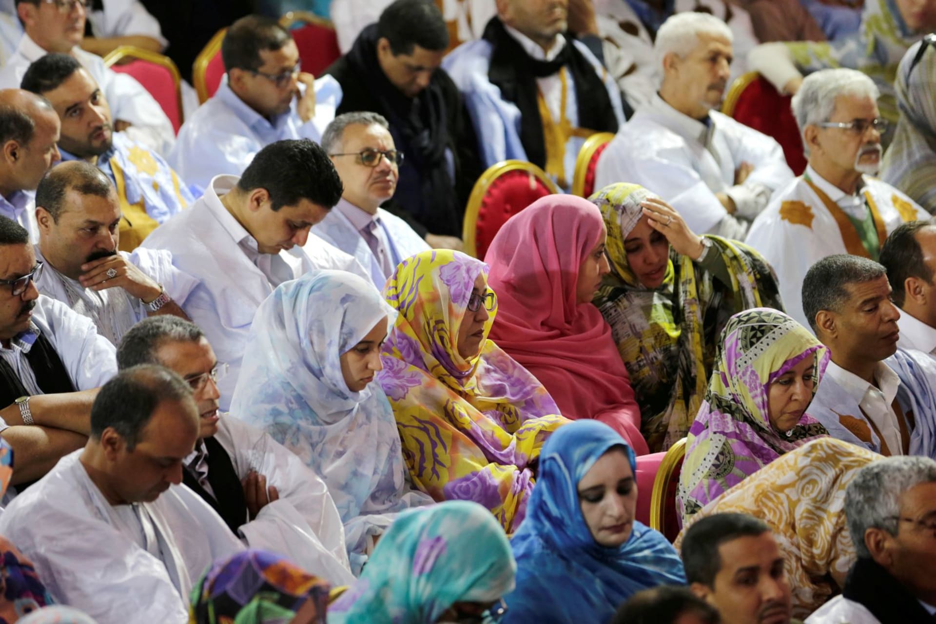 <p>Sahrawi men and women at a meeting of party leaders in Laayoune, a city in the territory of Western Sahara.</p>
