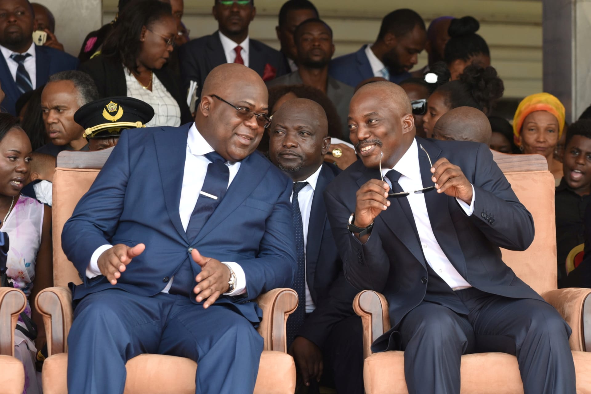 <p>Democratic Republic of Congo’s outgoing President Joseph Kabila sits next to his successor Felix Tshisekedi during the latter’s inauguration ceremony at the Palais de la Nation in Kinshasa, Democratic Republic of Congo on January 24, 2019.</p>