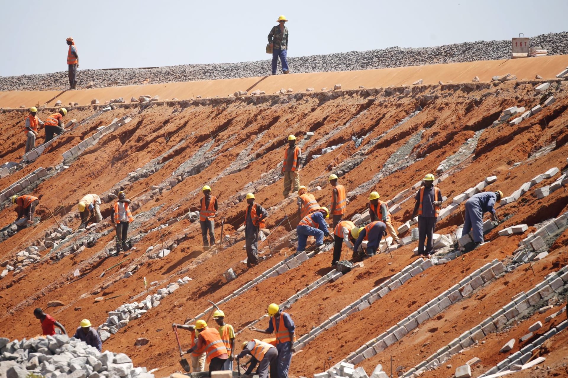 <p>Construction workers work on the new standard gauge railway line near Voi town, Kenya on March 16, 2016.</p>
