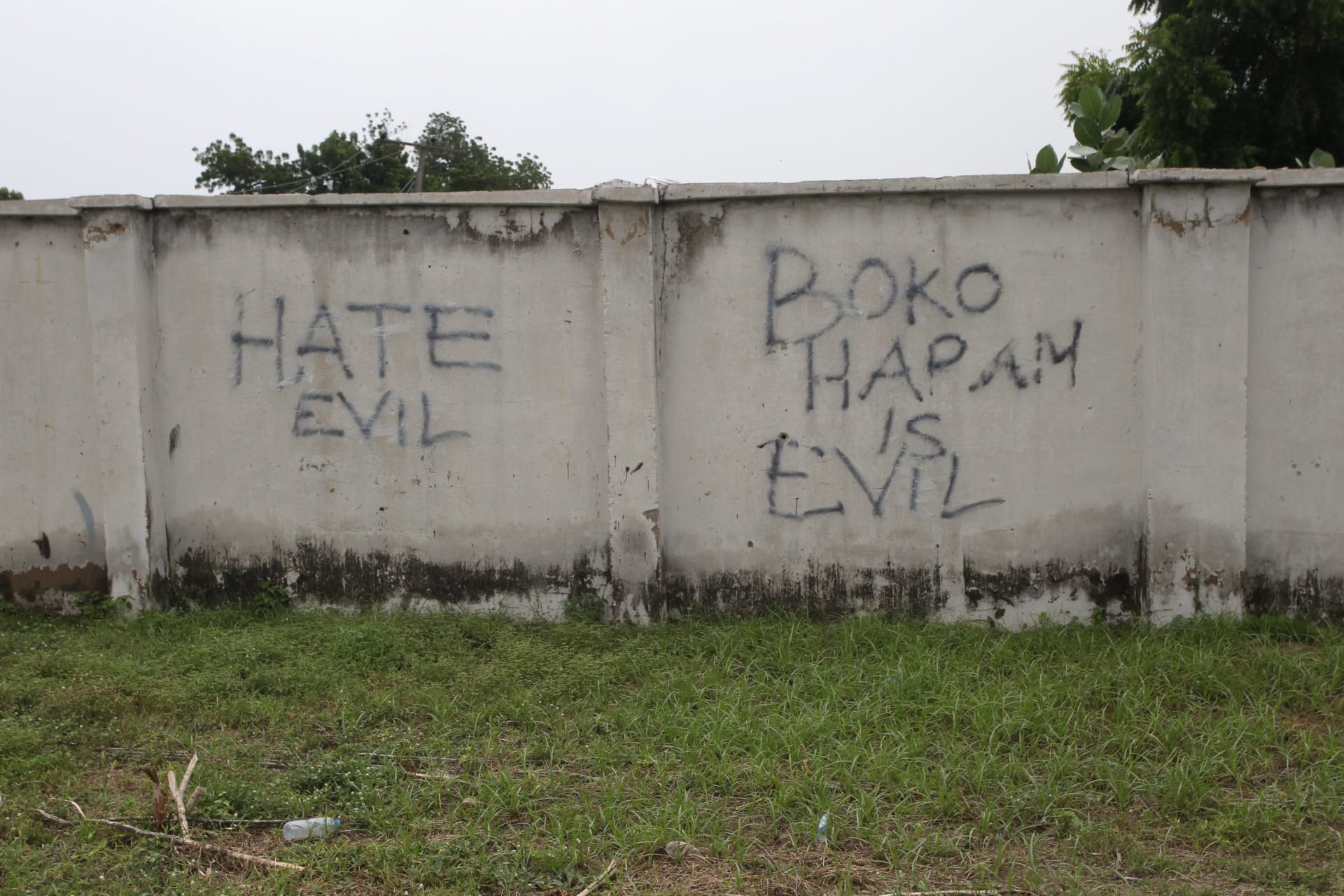 <p>Writings describing Boko Haram are seen on the wall along a street in Bama, in Borno, Nigeria on August 31, 2016.</p>
