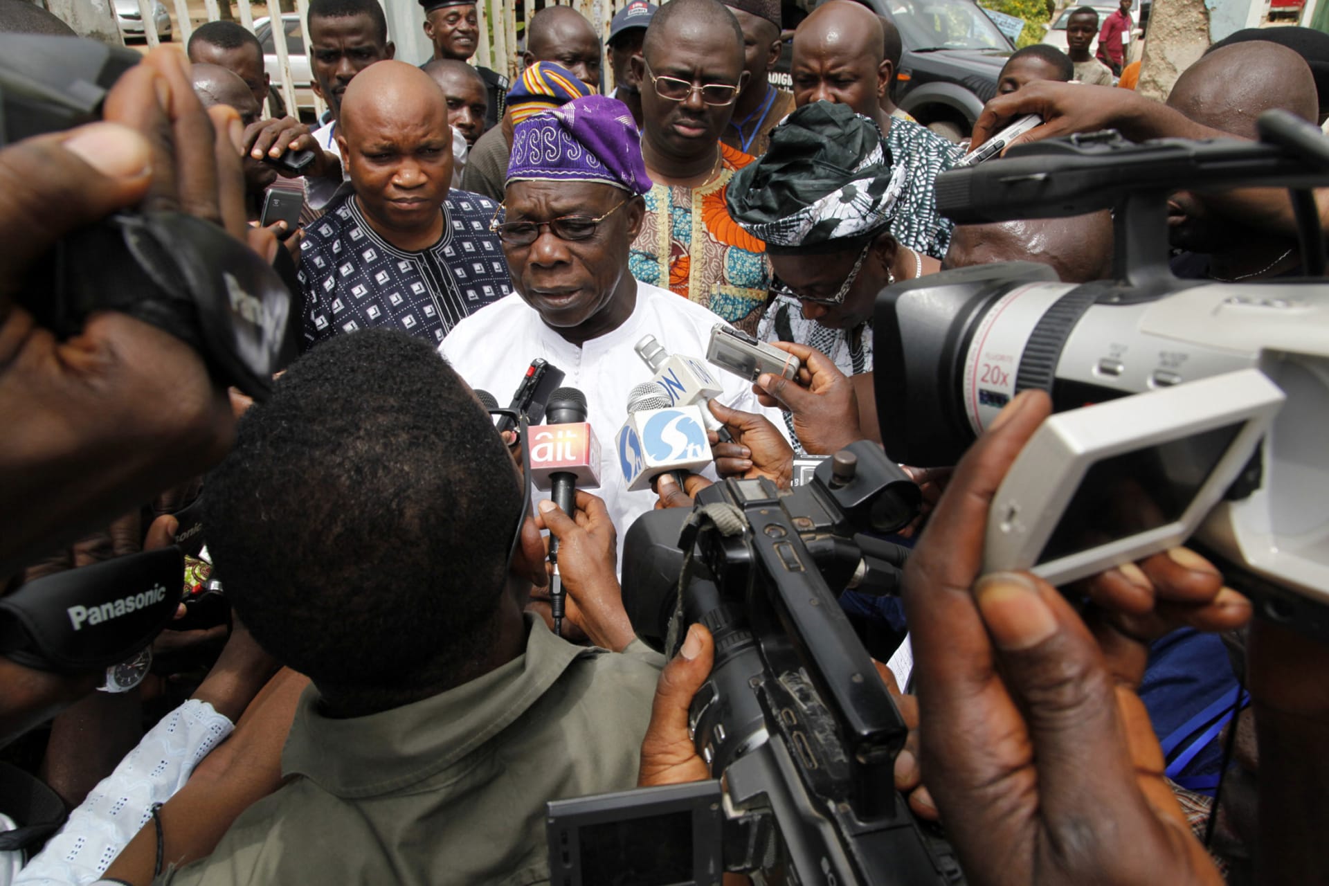 <p>Former Nigerian President Olusegun Obasanjo is interviewed by journalists after casting his vote during the parliamentary elections at Ita-Eko district in Abeokuta, southwest Nigeria on April 9, 2011.</p>
