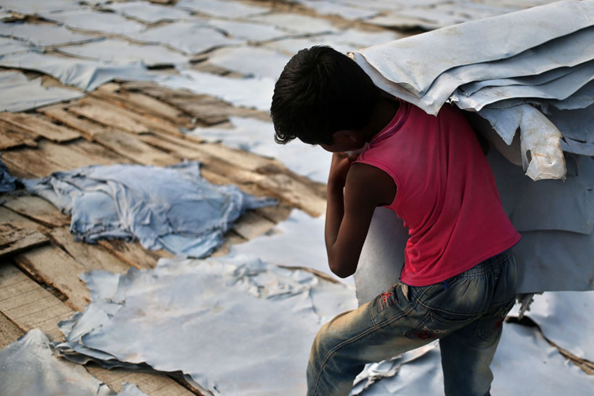 <p>A ten year old works at a leather tannery in Bangladesh, where enforcing international laws against child labor in the supply chain is increasingly difficult.</p>
