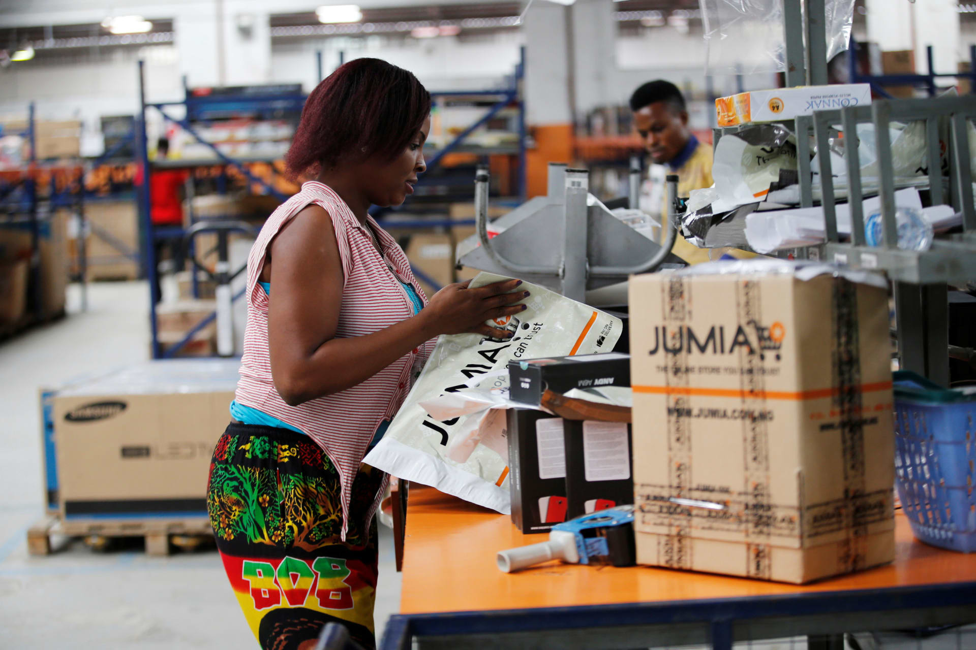 <p>A woman works at a warehouse for Jumia, an e-commerce company, in Lagos, Nigeria.</p>

