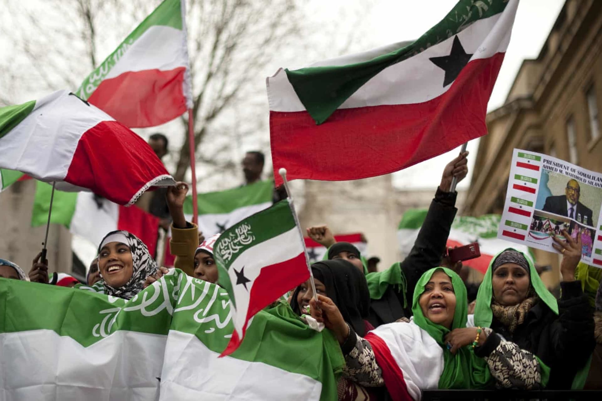 <p>UK-based Somalilanders waving the self-declared republic’s flag at a rally near Downing Street in London, United Kingdom, in 2012.</p>
