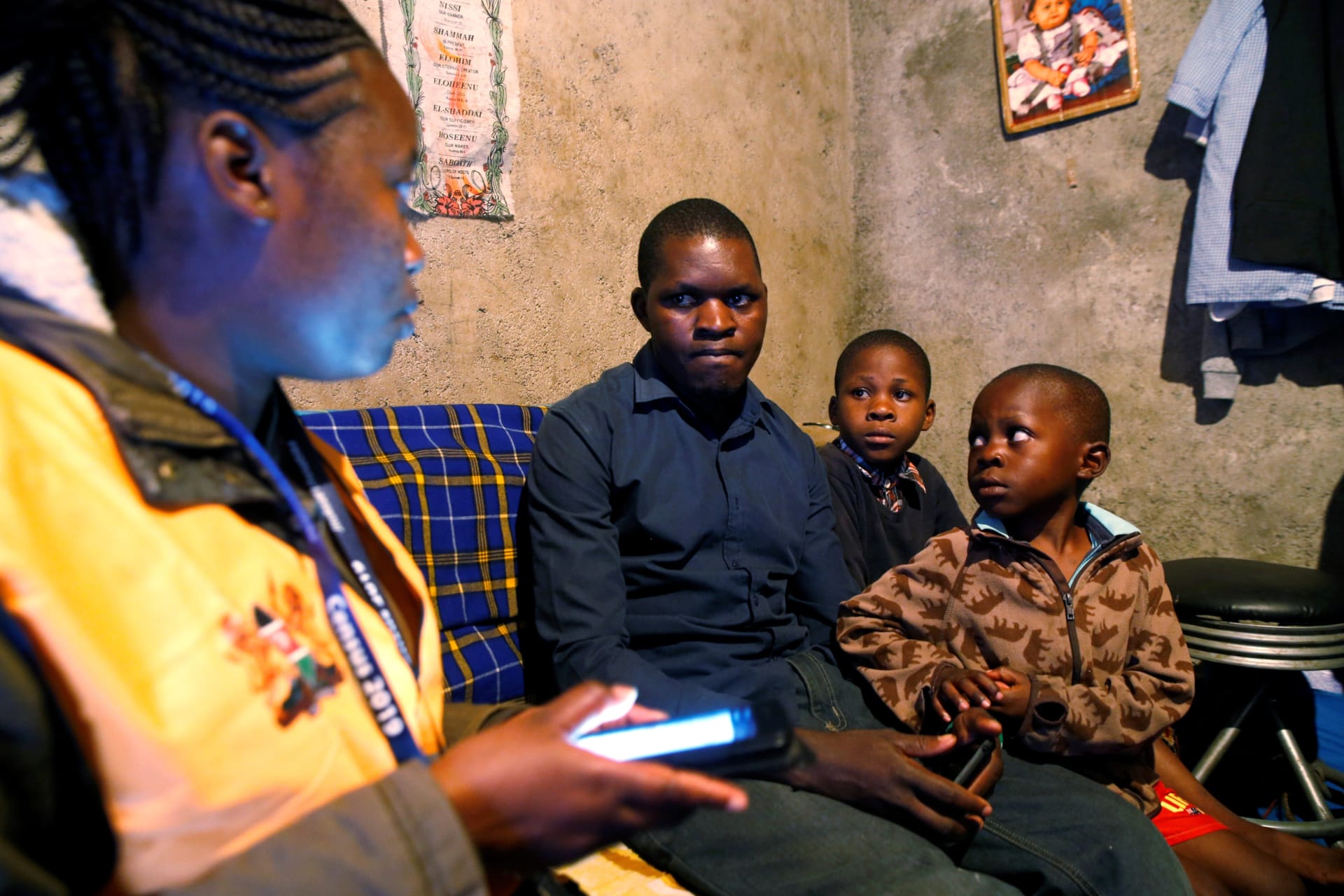 <p>An enumerator uses a census laptop to record details of a family participating in the 2019 Kenya Population and Housing Census at the Kibera slum in Nairobi, Kenya on August 24, 2019.</p>
