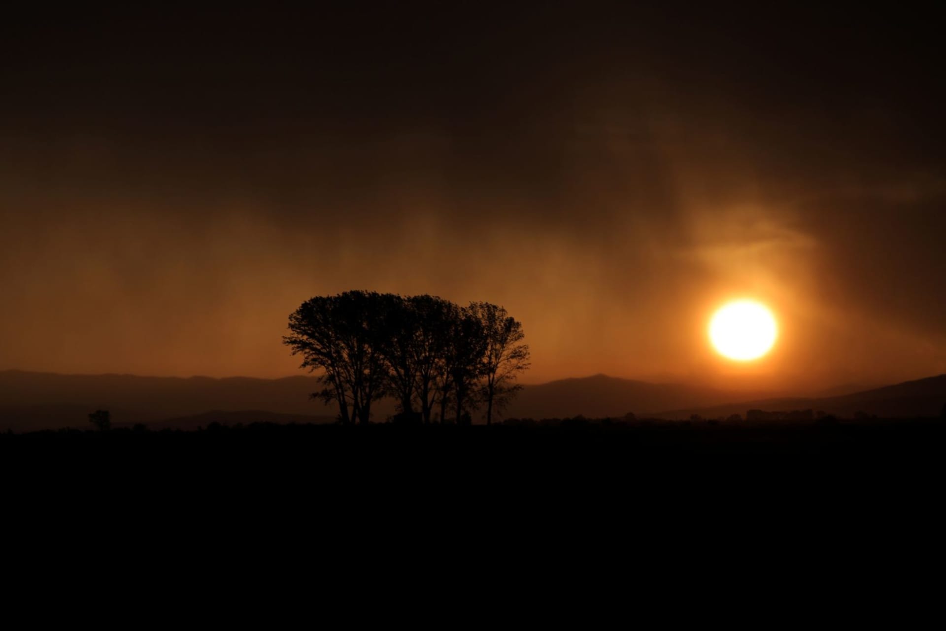 <p>Rain clouds are lit by the setting sun near the village of Chernogorovo, Bulgaria on July 3, 2019. </p>

