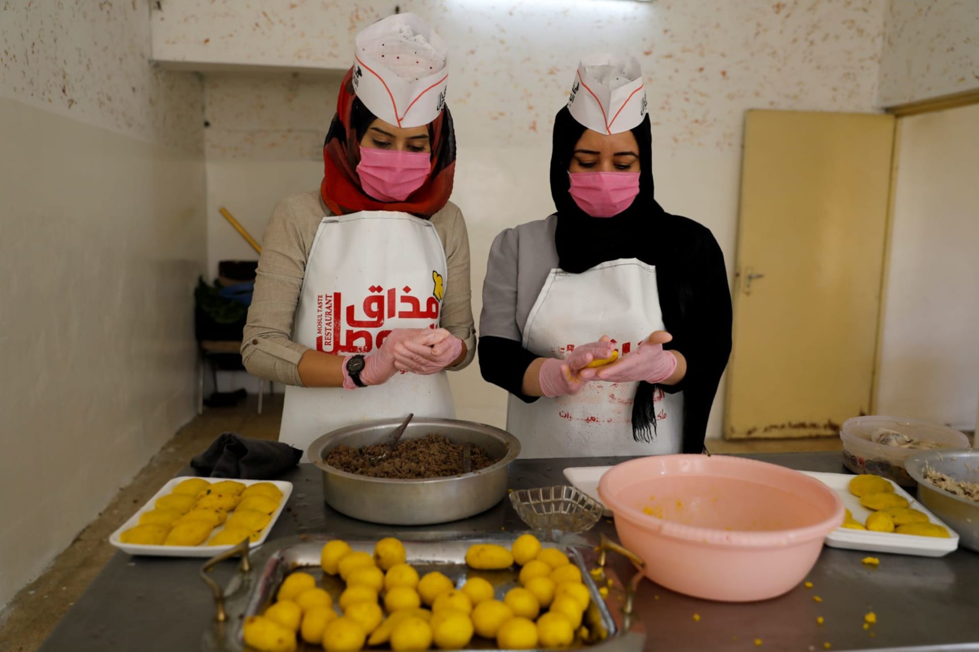<p>Iraqi women prepare food in kitchen run by Mahiya Yousef, who created her business in order to help women looking for work in Mosul.</p>
