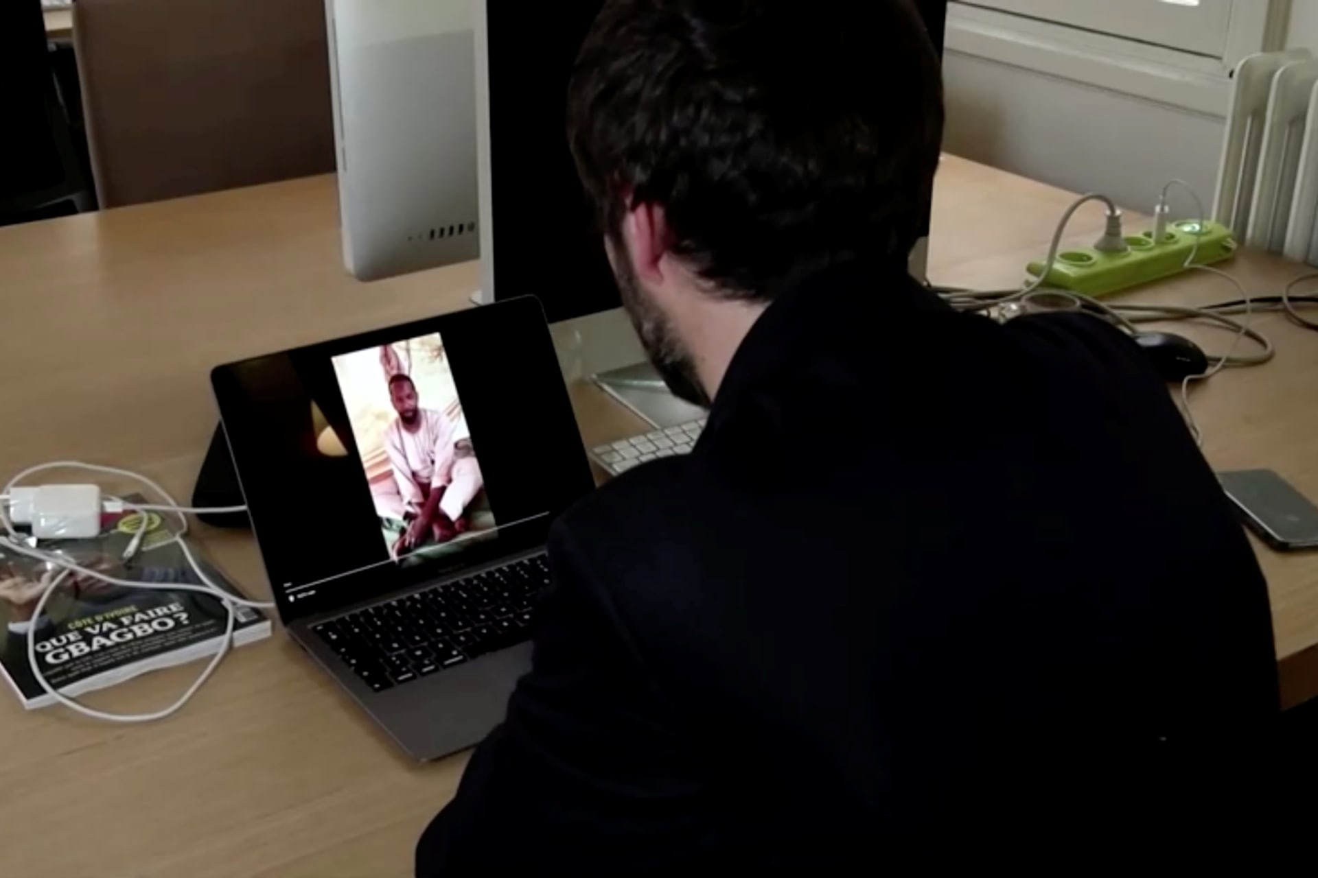 <p>Reporters Without Borders Africa Researcher Arnaud Froger watches a video showing what is believed to be French journalist Olivier Dubois, who disappeared last month in Mali’s northern city of Gao, in Paris, France on May 5, 2021,</p>
