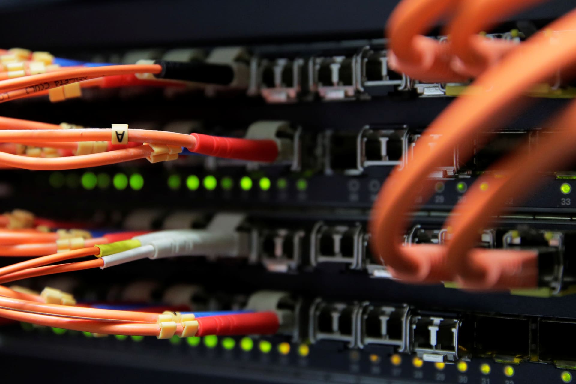<p>Computer network equipment is seen in a server room.</p>
