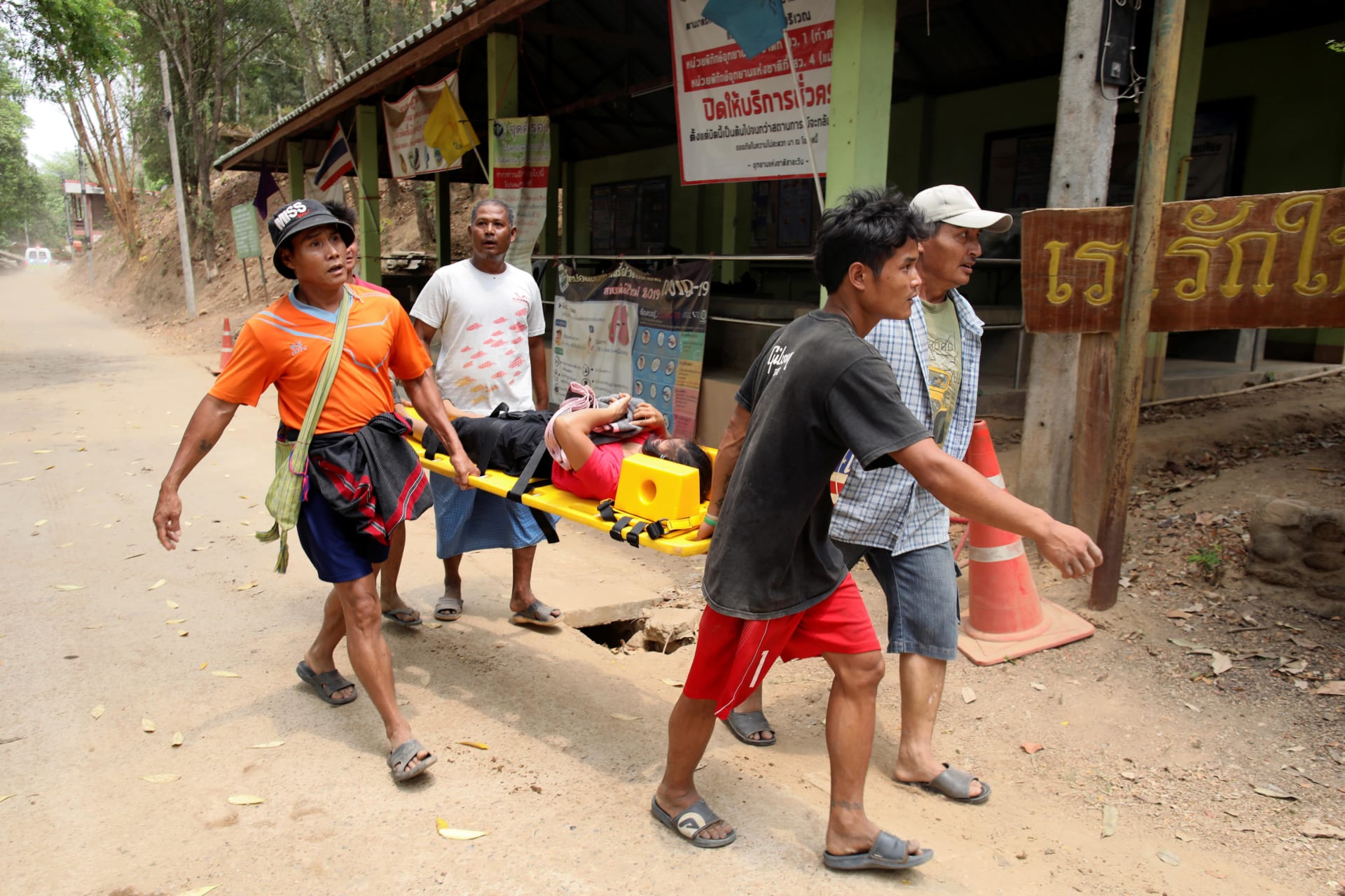 <p>A wounded person who is fleeing the violence in Myanmar lies on a stretcher to receive medical treatment at the Thai border village of Mae Sam Laep, Mae Hong Son province, Thailand, on March 30, 2021.</p>
