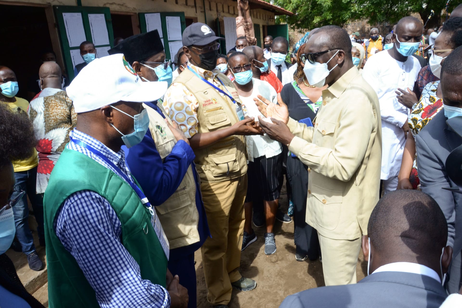 <p>Benin’s President Patrice Talon talks to African Union observers after casting his ballot at a polling station in Cotonou, Benin on April 11, 2021.</p>
