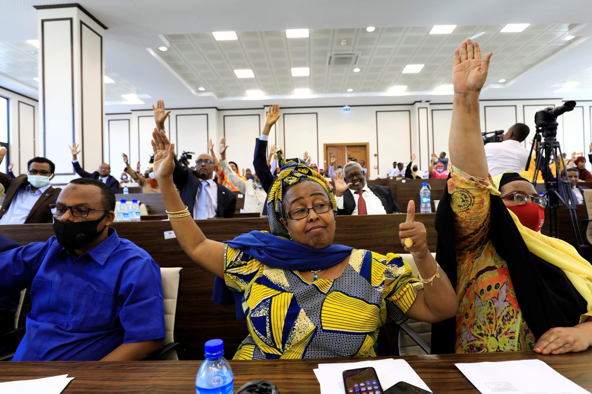 <p>Somali legislators of the lower house of parliament raise their hands to vote to extend President Mohamed Abdullahi Mohamed’s term for another two years to let the country prepare for direct elections, in Mogadishu, Somalia on April 12, 2021</p>
