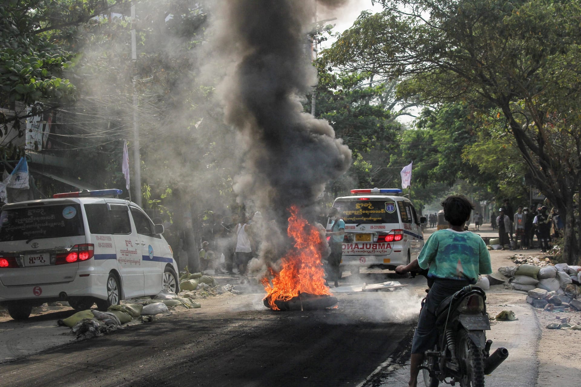 <p>A fire burns on the street during a protest against the military coup, in Mandalay, Myanmar on April 1, 2021.</p>
